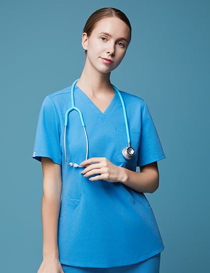 Image of A women facing forward wearing ceil blue scrubs, with a matching stethoscope around her neck,Ceil Blue