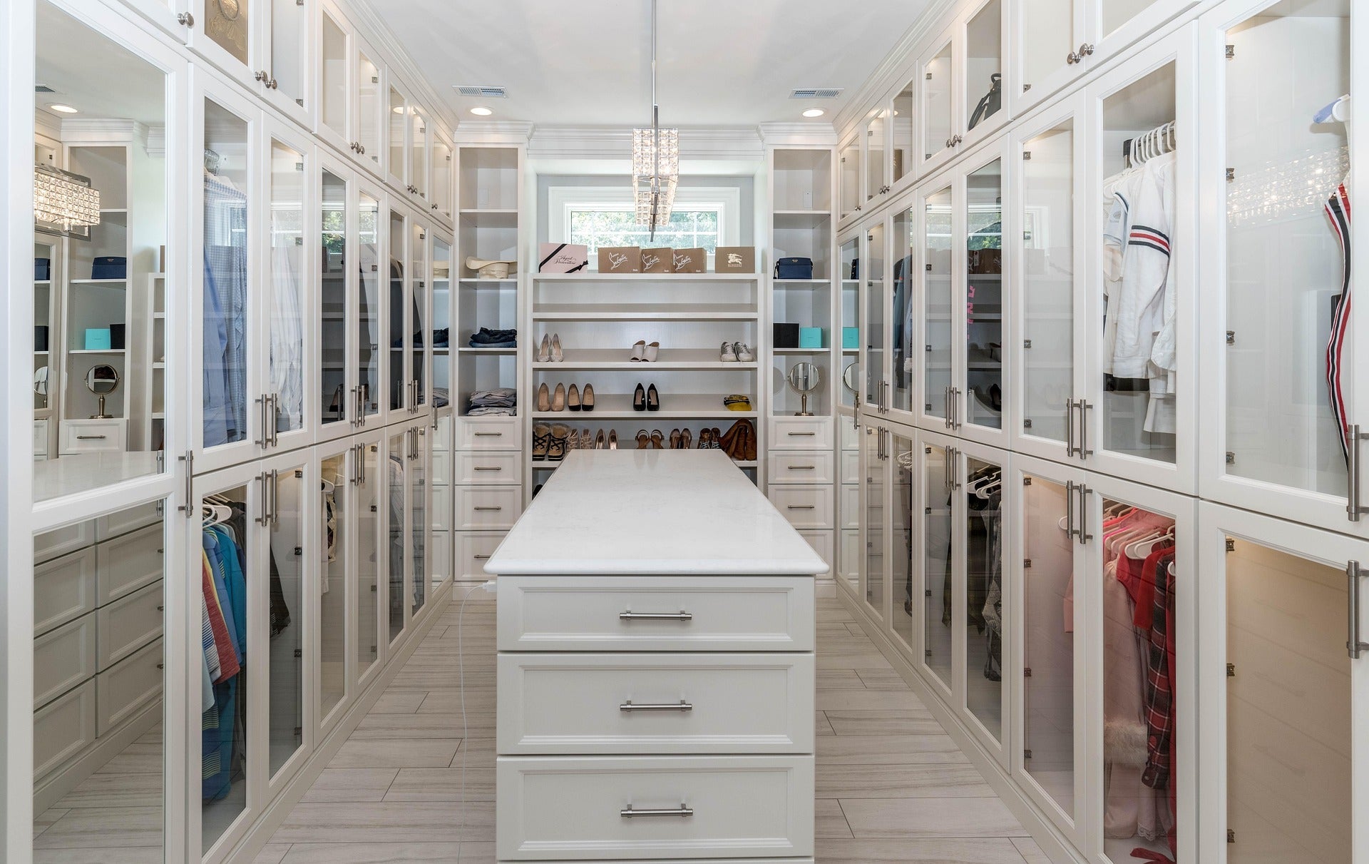 Image of Image of scrubs of multiple colors stored in a walk in closet.
