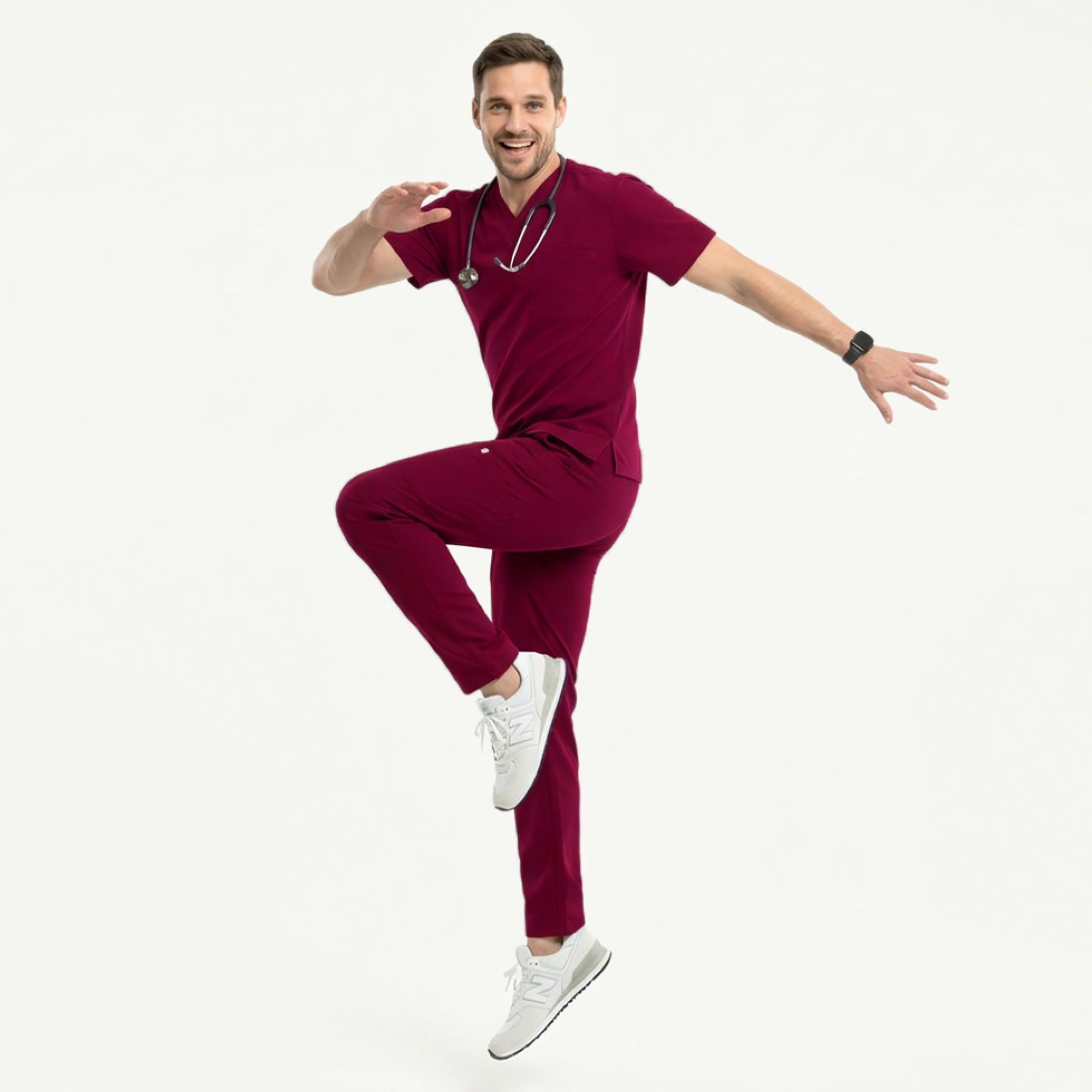 Image of Man wearing burgundy V-neck scrub top and 8-pocket straight scrub pants, paired with white sneakers and a name badge,Burgundy