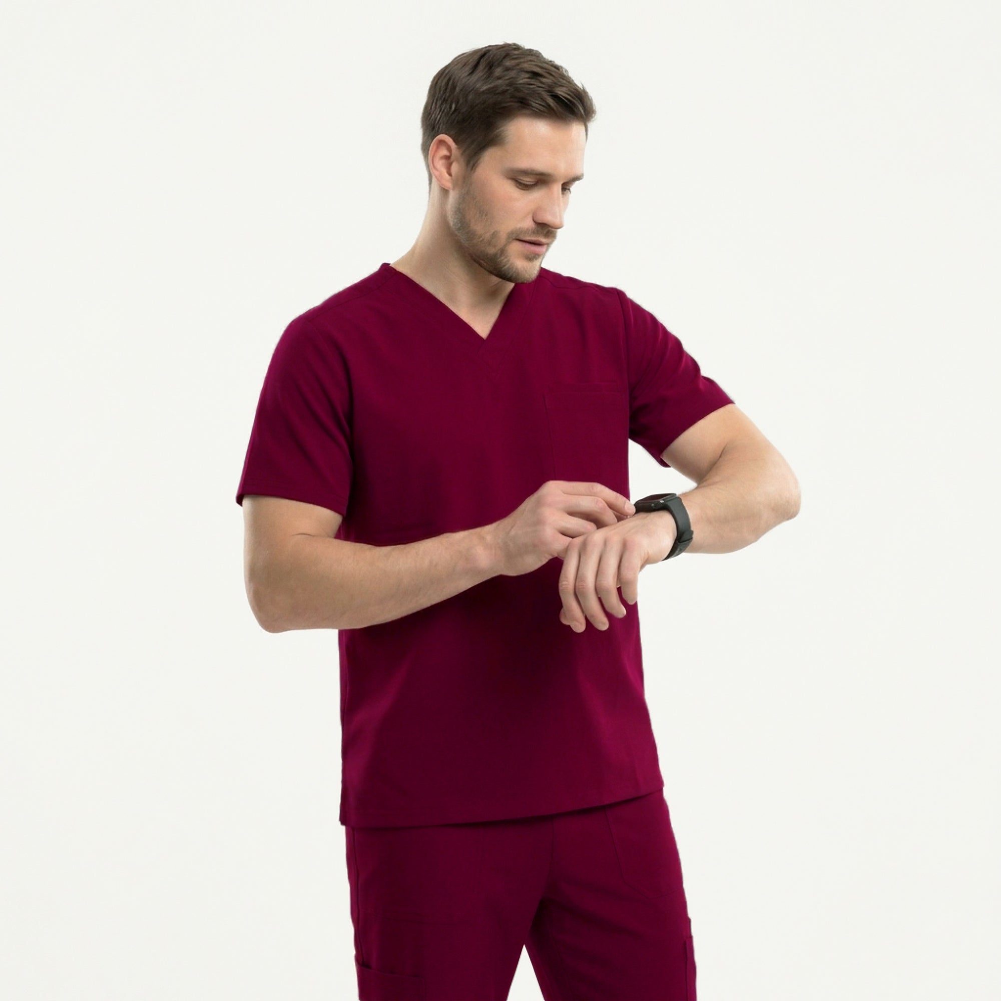 Image of Close-up of a burgundy V-neck scrub top featuring a chest pocket with badge holder and pen, paired with matching scrub pants,Burgundy