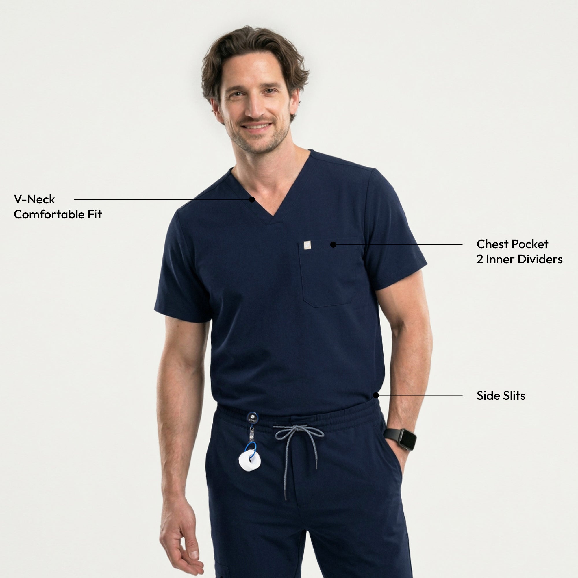 Image of Man wearing a navy scrub set with a single-pocket top, holding a black bag and accessorized with a retractable badge reel,Eco Navy