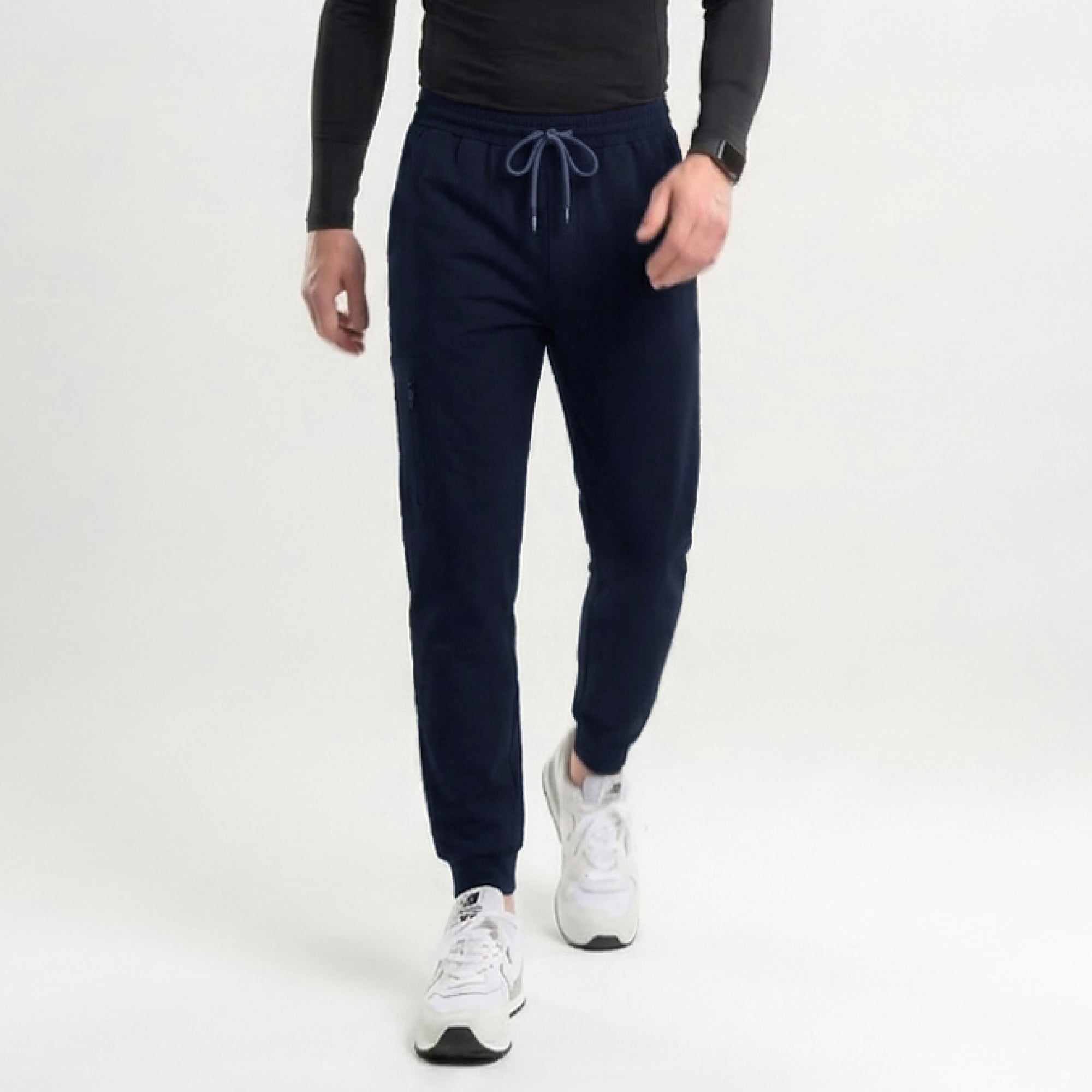 Image of Front view of navy jogger scrub pants with a zipper pocket and elastic cuffs,Eco Navy