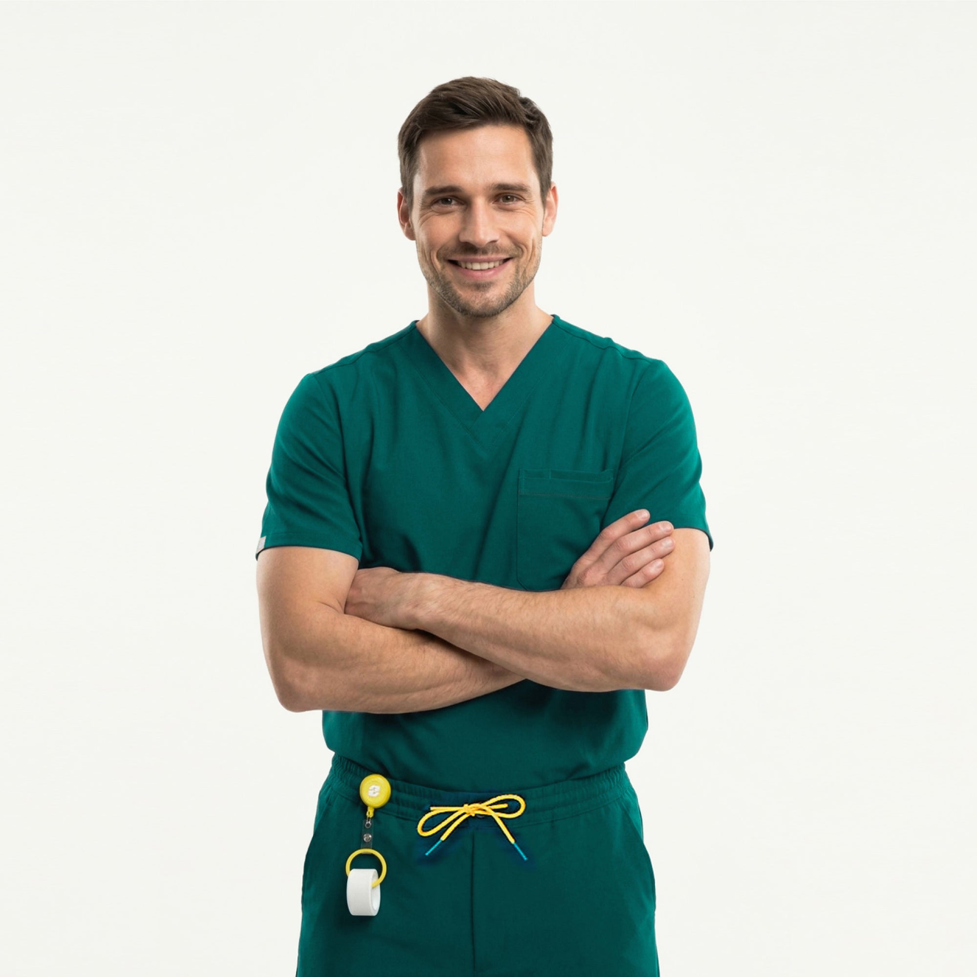 Image of Wearing a Pine Green 3 Pocket Scrub Top, the model sits comfortably with a slight smile.