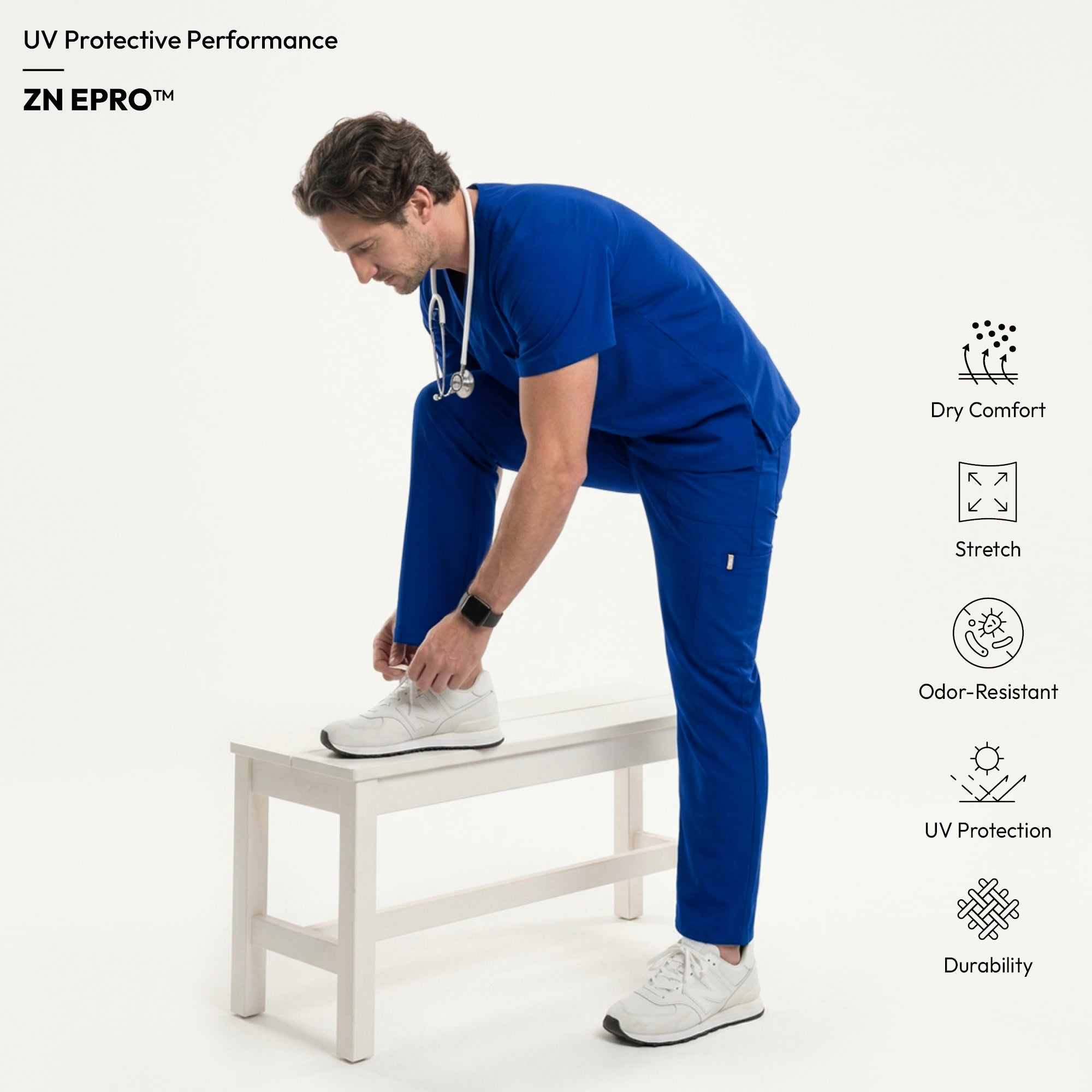 Image of Man wearing a royal blue V-neck scrub top with matching pants, carrying a light blue duffel bag and wearing a stethoscope around his neck,Royal Blue