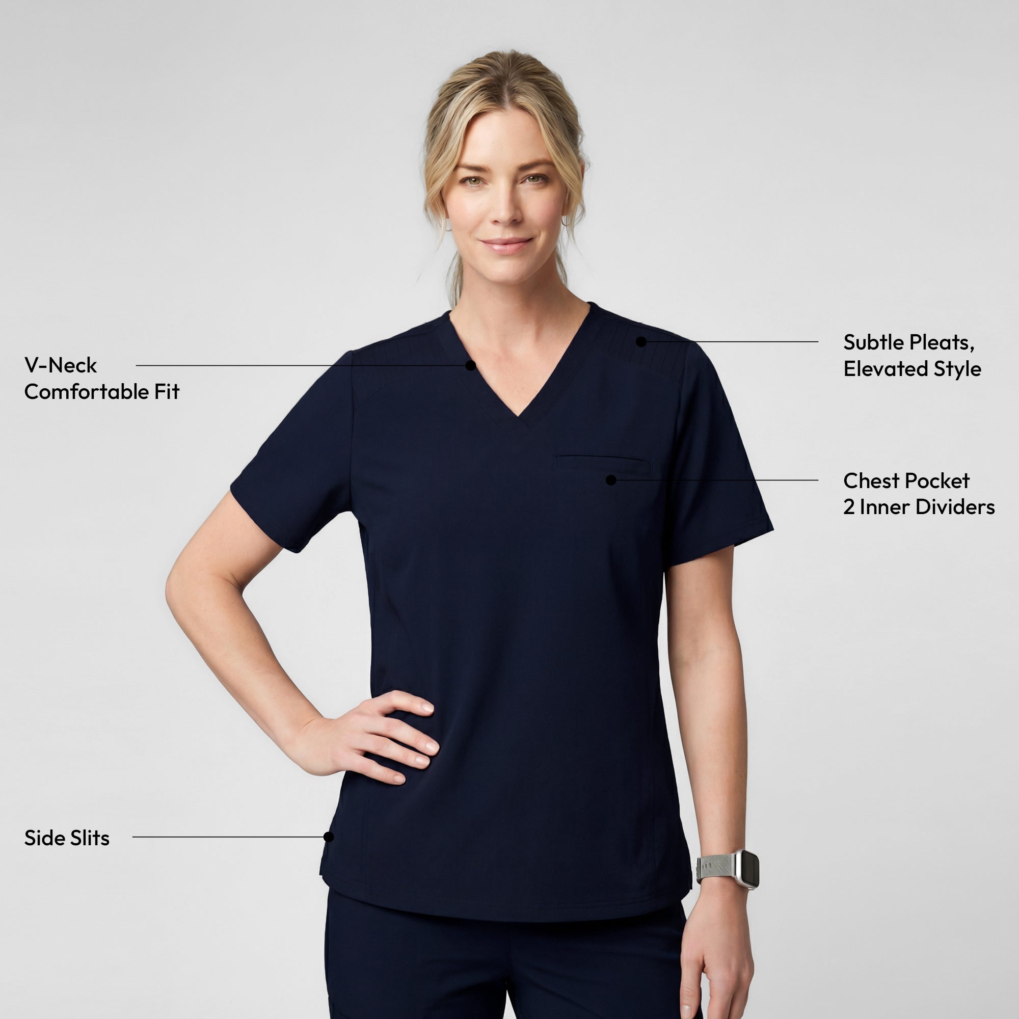 Image of Smiling in the Women's Eco Navy Pleated Shoulder Scrub Top and pants, holding a navy backpack, upper body view