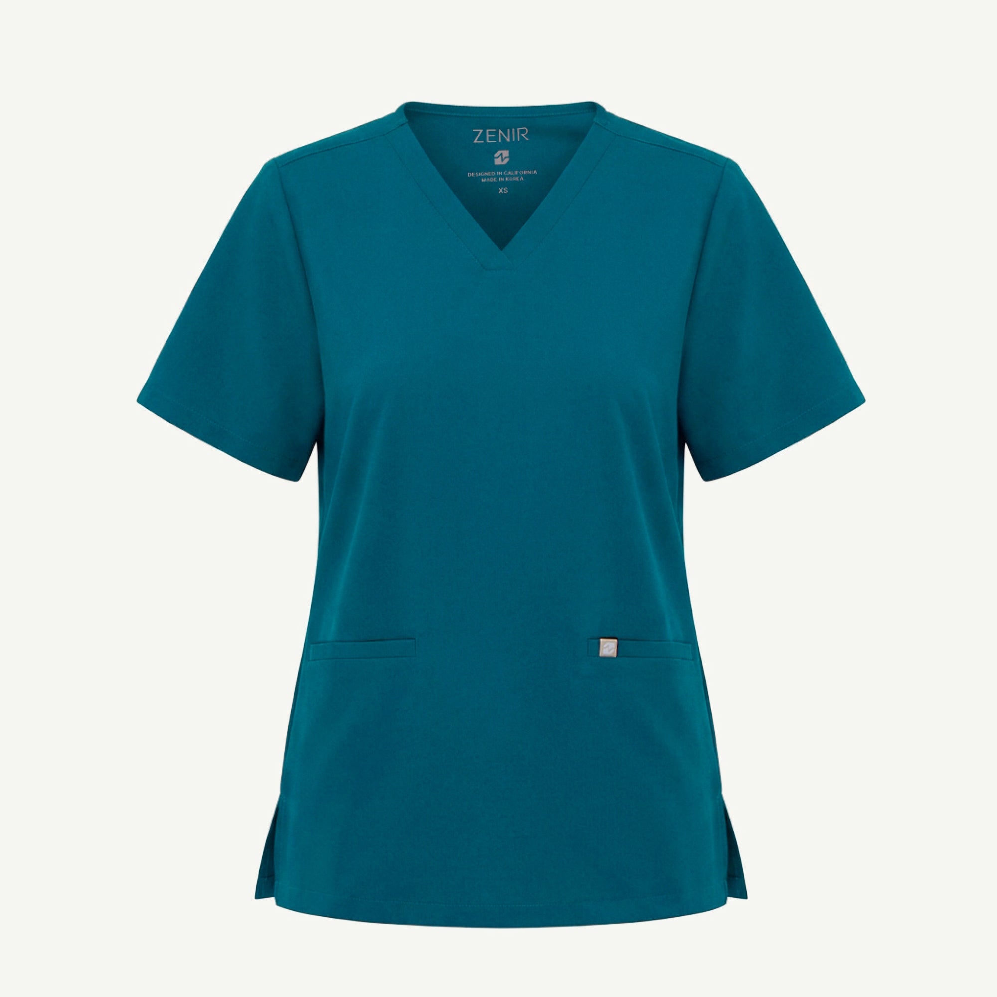 Image of The Ocean Teal Double Pocket Scrub Top presents a clean, structured back design with a relaxed fit that allows natural movement.