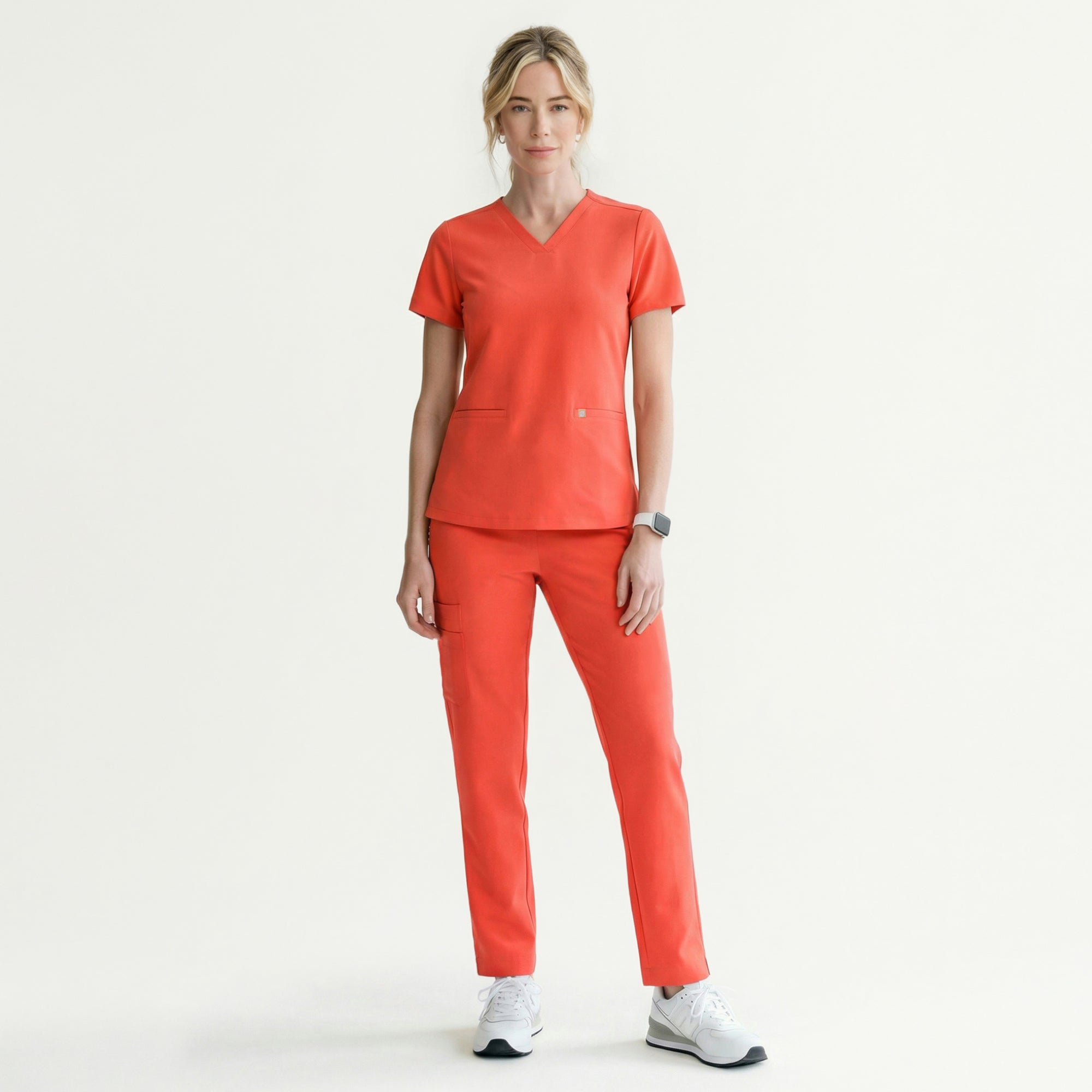Image of Designed with a relaxed yet polished fit, it offers practicality with double front pockets and an easy-moving silhouette—ideal for all-day wear in active medical settings.