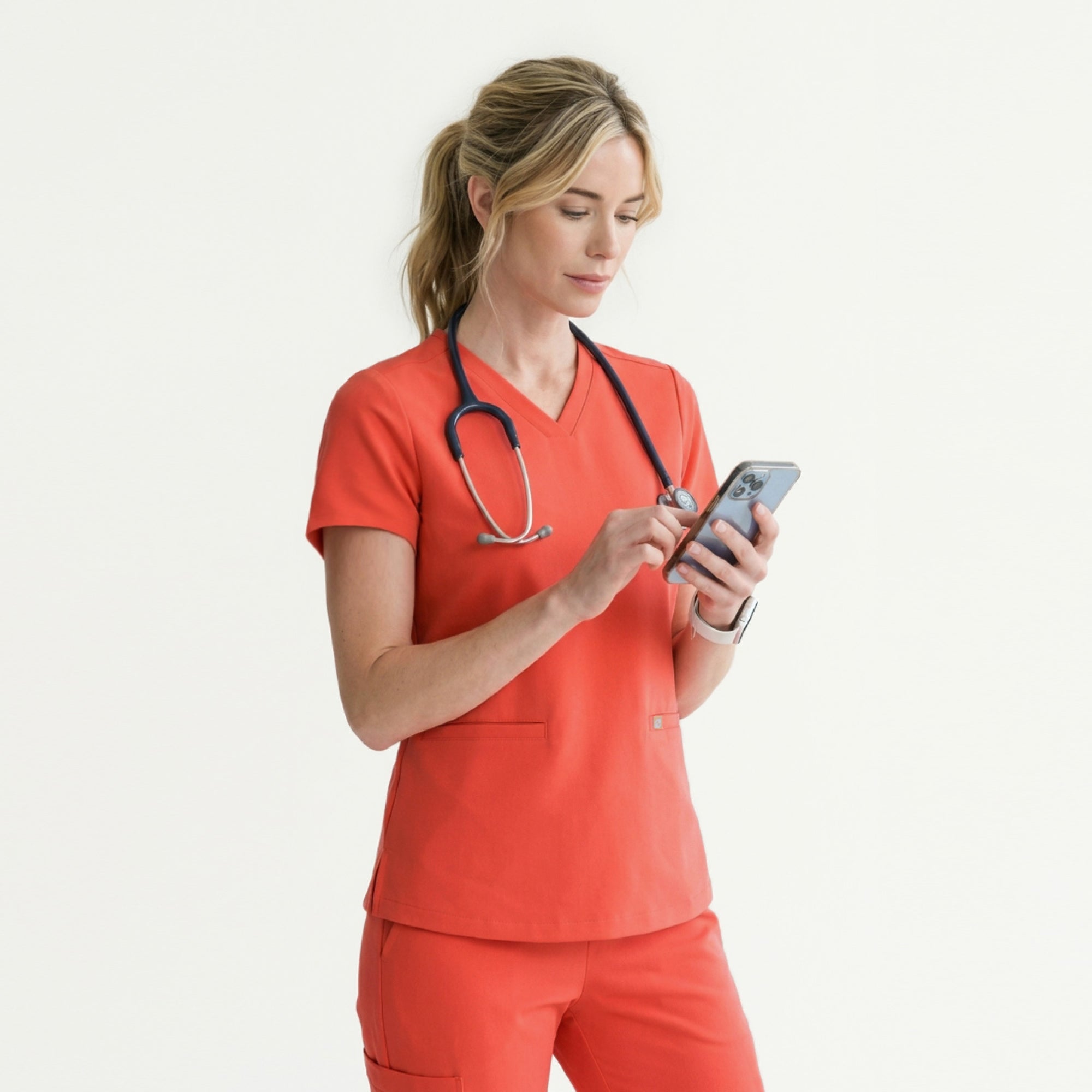 Image of Tiger Orange Double Pocket Scrub Top showcases a clean and minimal back profile with subtle side slits for ease of movement.
