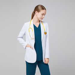 Image of Model facing forward wearing a white short lab coat, blue scrub top and bottom, and a yellow stethoscope with her face turned sideways,White