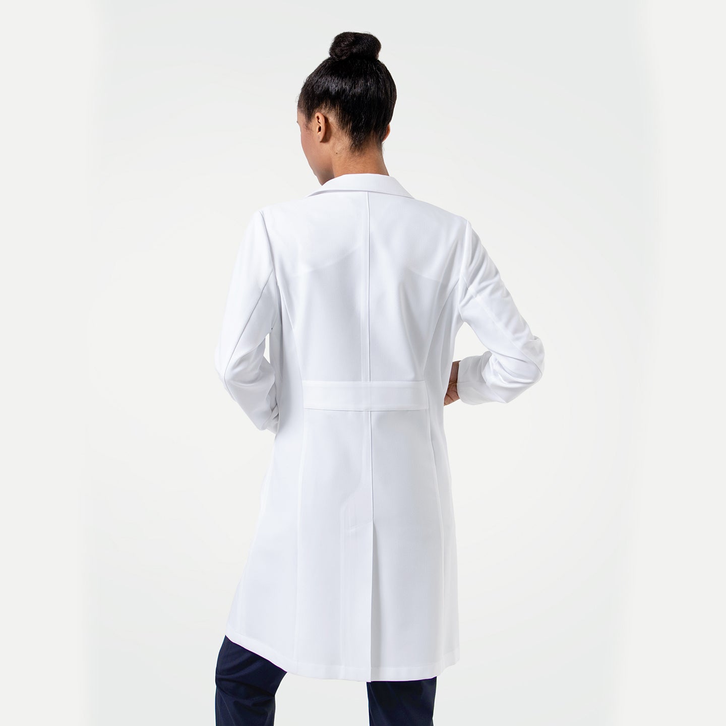 Image of A clean, professional white women’s lab coat featuring a tailored fit, notched lapels, and spacious front pockets, shown from front and back to highlight its structured silhouette.