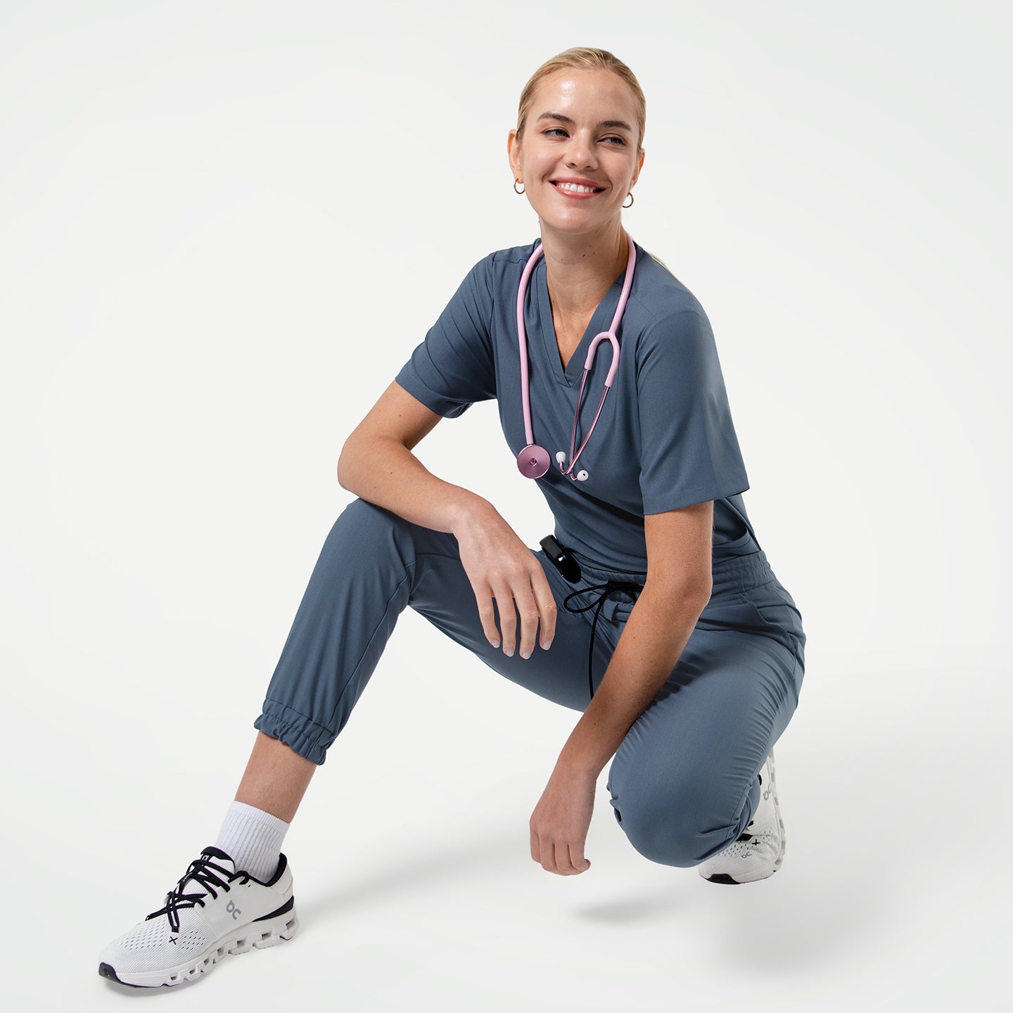Image of Smoky Blue scrub pants and scrub top set styled in a modern jogger fit