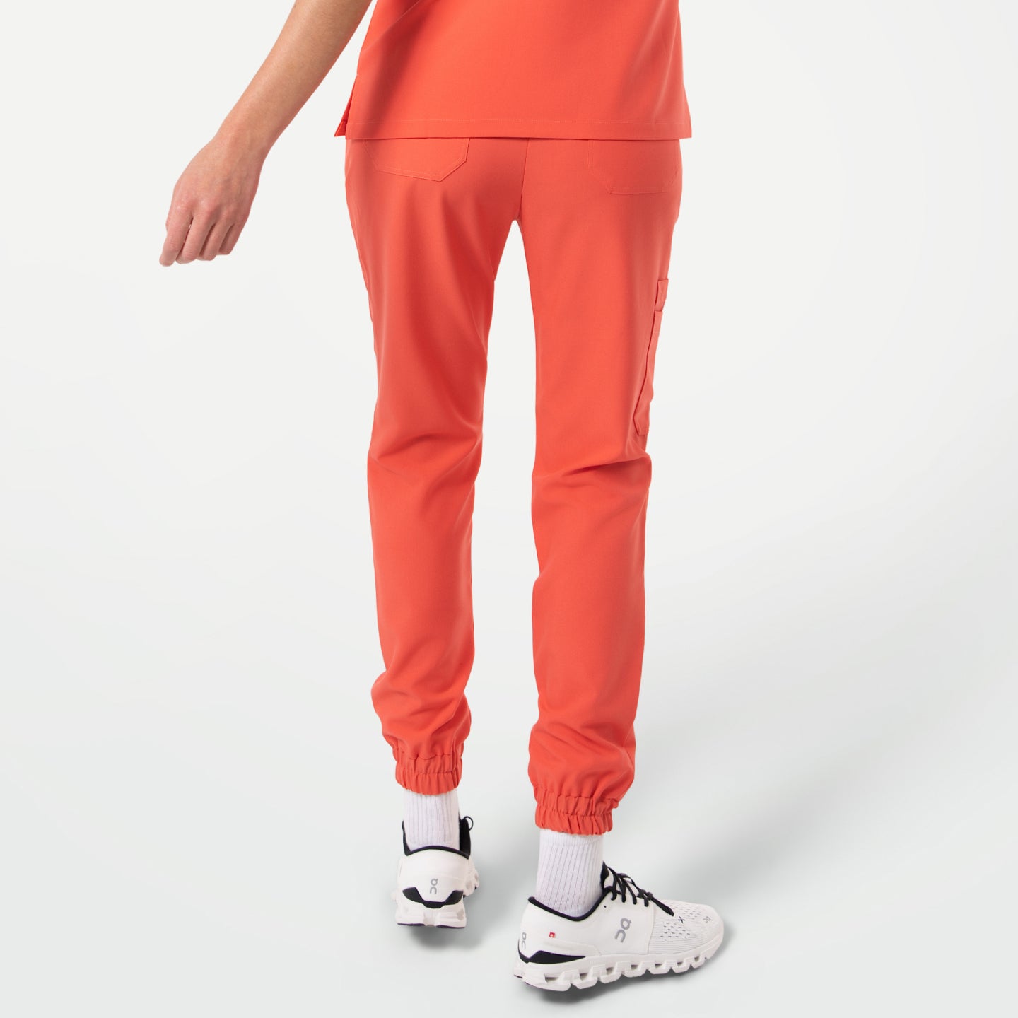 StretchFit Jogger Scrub Pants in Tiger Orange shown from the back