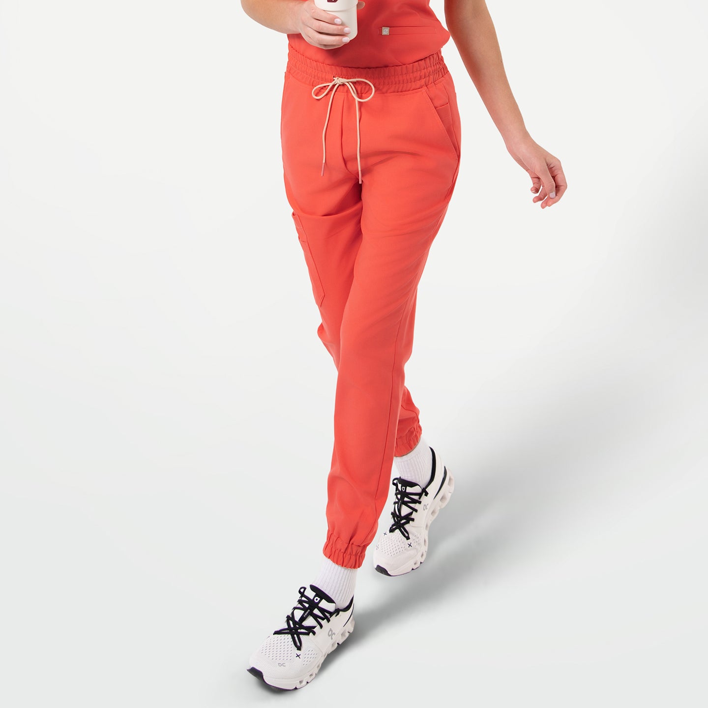 Image of StretchFit Jogger Scrub Pants in Tiger Orange, front walking view