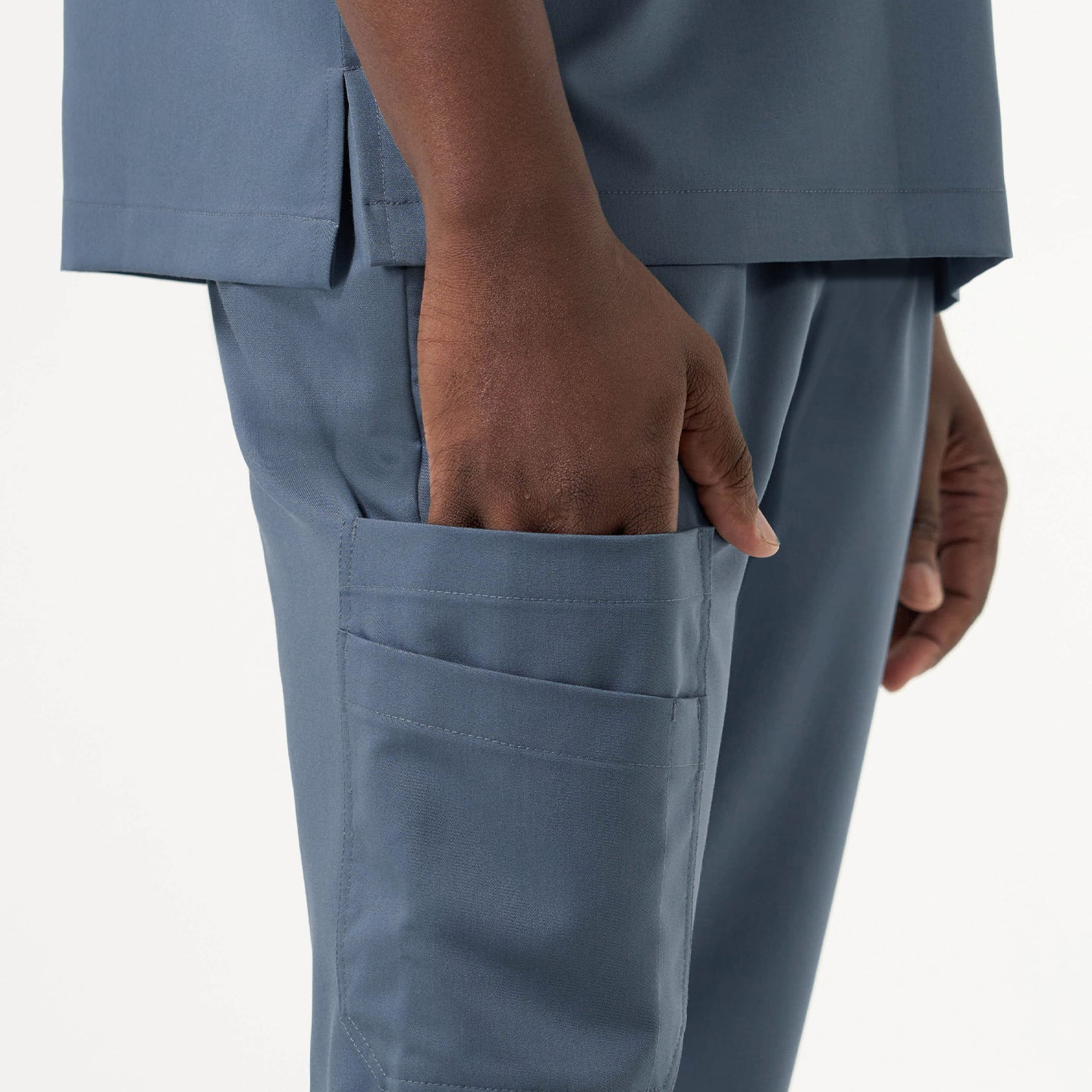 Image of Side view highlighting the practical storage pocket on the Smoky Blue jogger scrub pants.