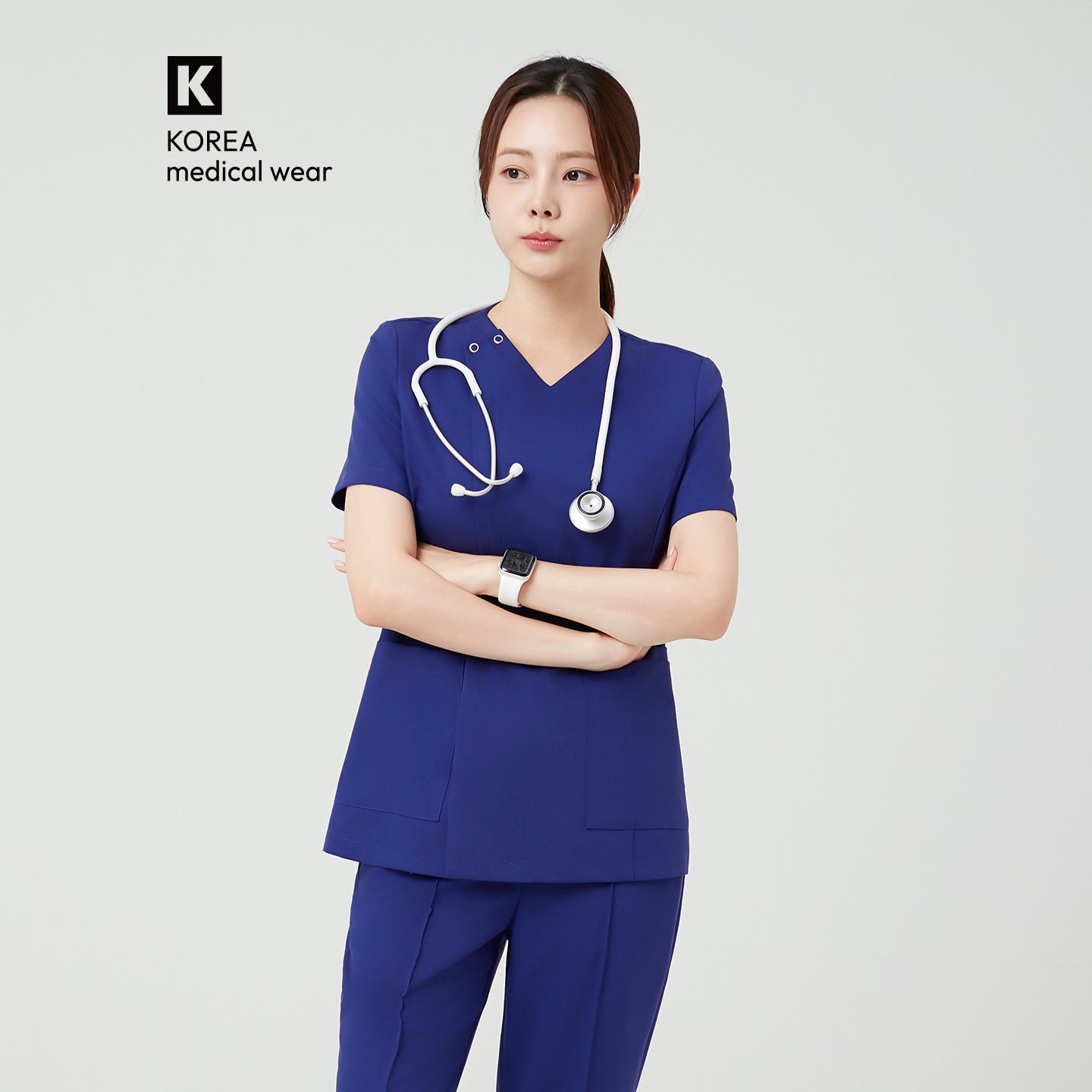 The Admiral Blue OS-226 scrub top showcases a clean V-neckline and structured silhouette, creating a sharp and professional appearance. Its rich blue tone adds depth and confidence, while the minimal seams and smooth finish emphasize a modern, tailored fit.