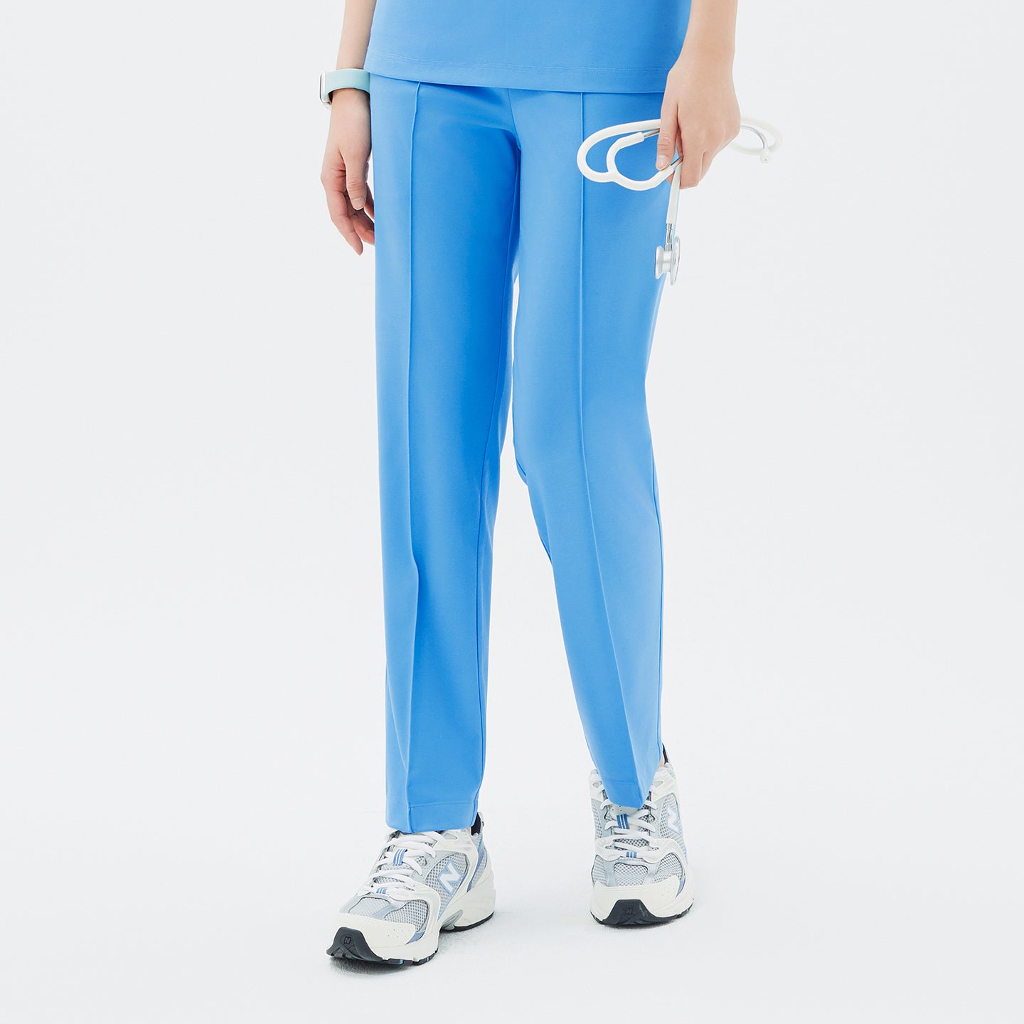 Featuring a sleek center crease and clean lines, the Aqua Blue Premium Banding Scrub Pants deliver a refined, polished appearance.