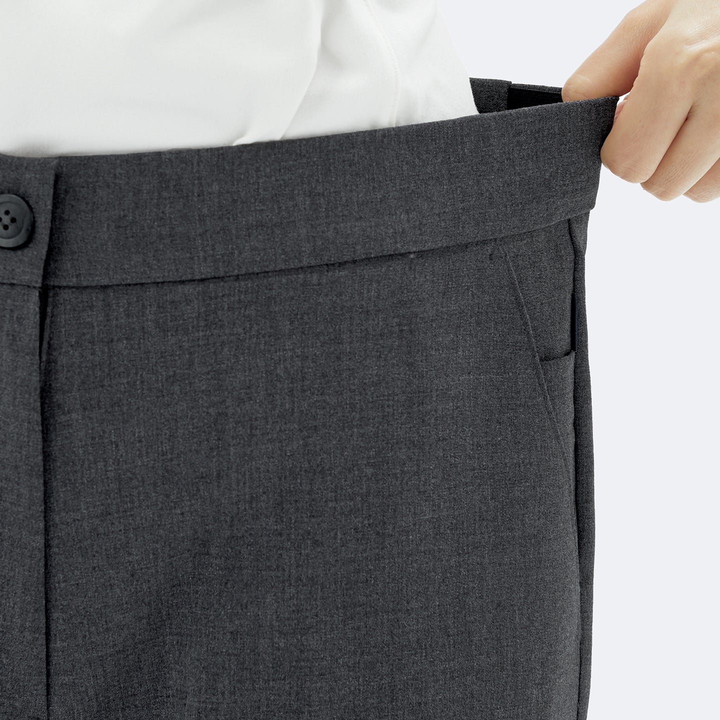 Image of The Charcoal Gray Pants feature a hidden side-banding waistband that flexibly expands for a comfortable fit.