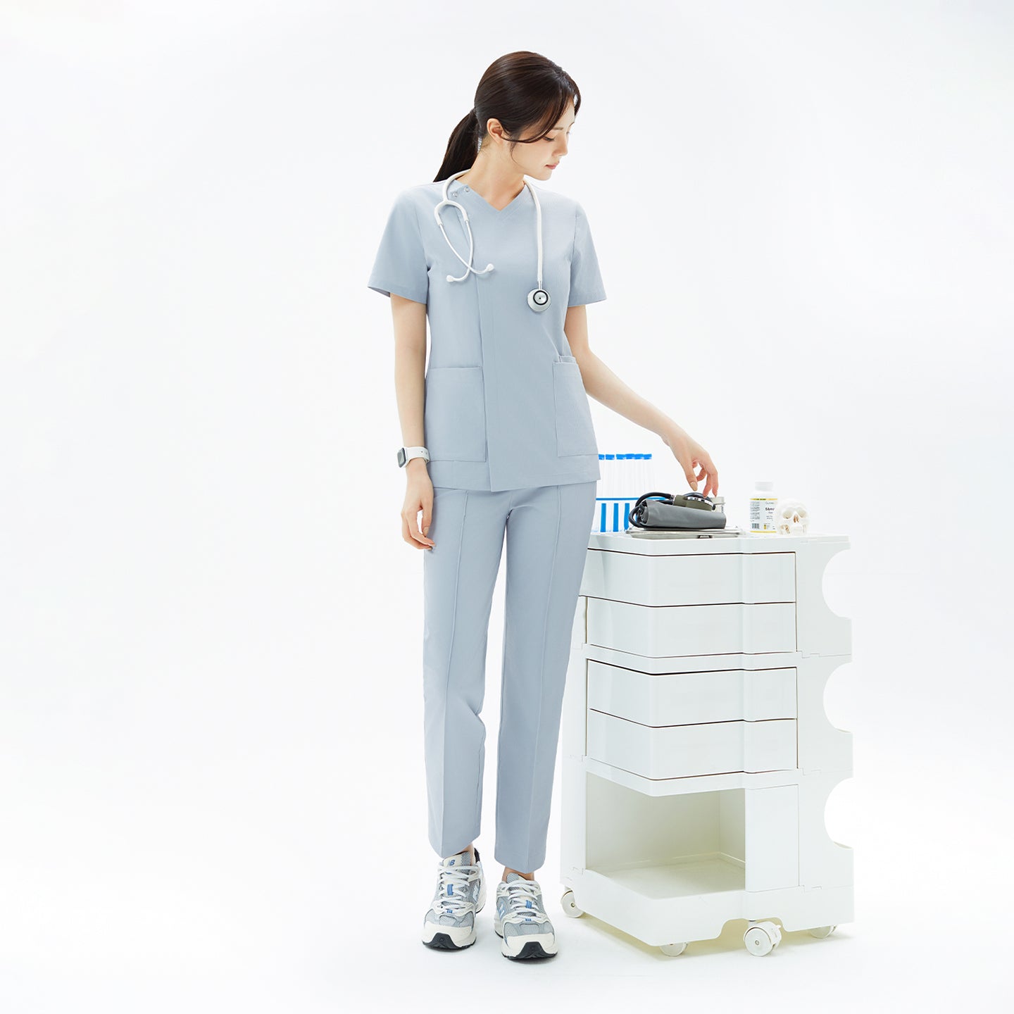 Capturing a sleek and composed moment, the Cool Gray OS-224 scrub set embodies calm professionalism. The structured V-neck top and straight-leg pants create a balanced silhouette, ideal for medical settings that demand both style and function.