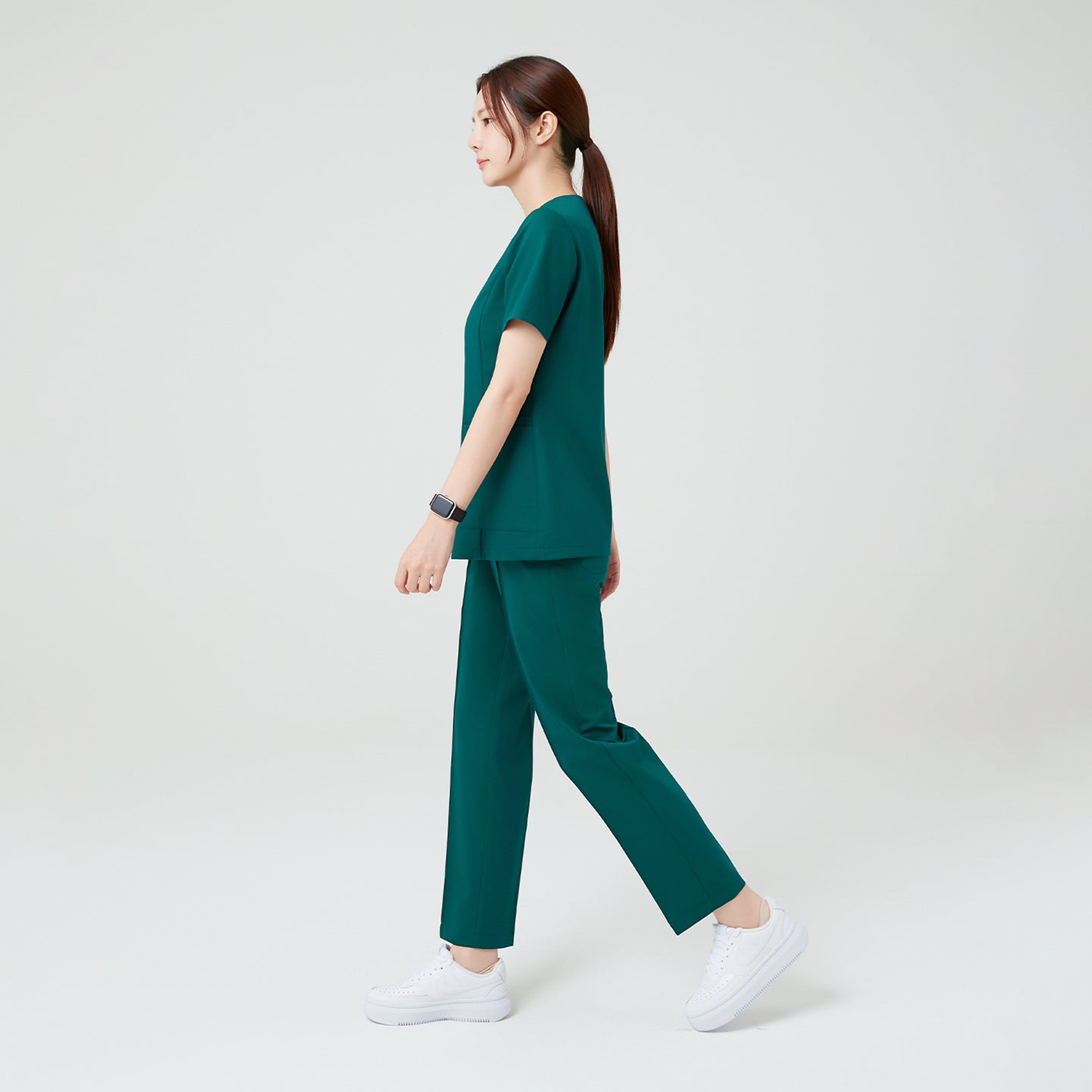 Featuring a straight, relaxed silhouette, the Pine Green OS-225 scrub set moves effortlessly with the body. The clean side profile and lightweight stretch fabric highlight both function and elegance in motion.