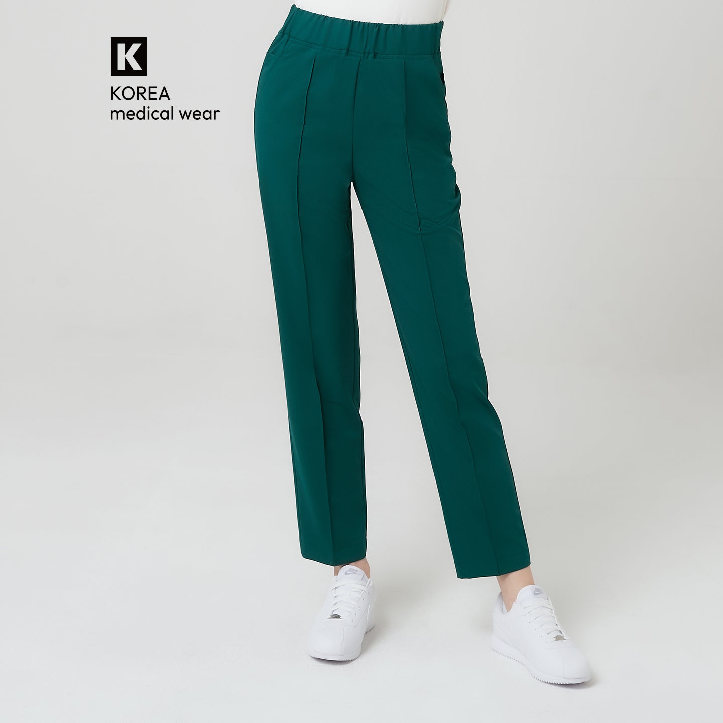 The Pine Green Premium Banding Scrub Pants feature a deep, elegant green hue that exudes sophistication.