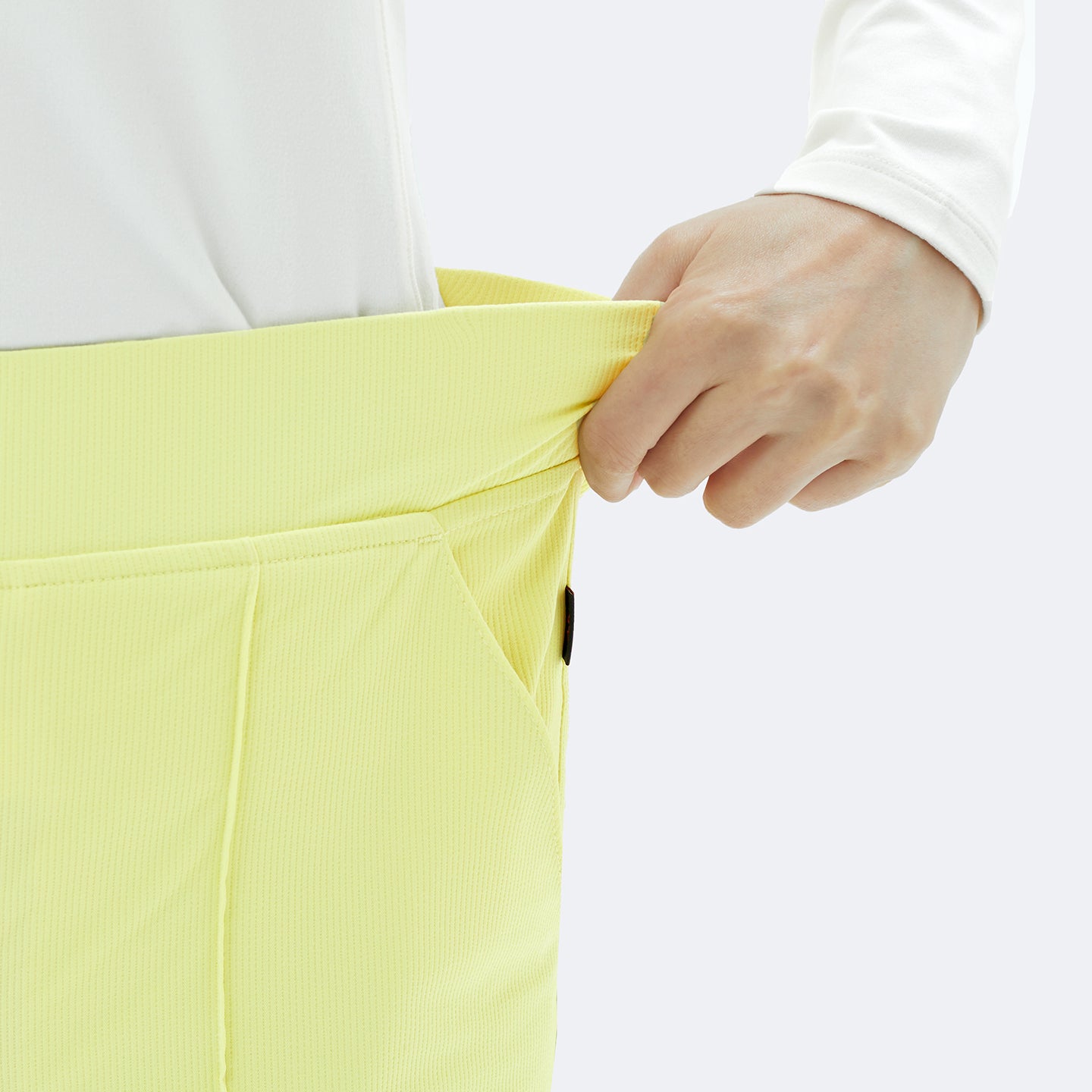 Close-up of the Pine Yellow Premium Banding Scrub Pants showing the flexible waistband.