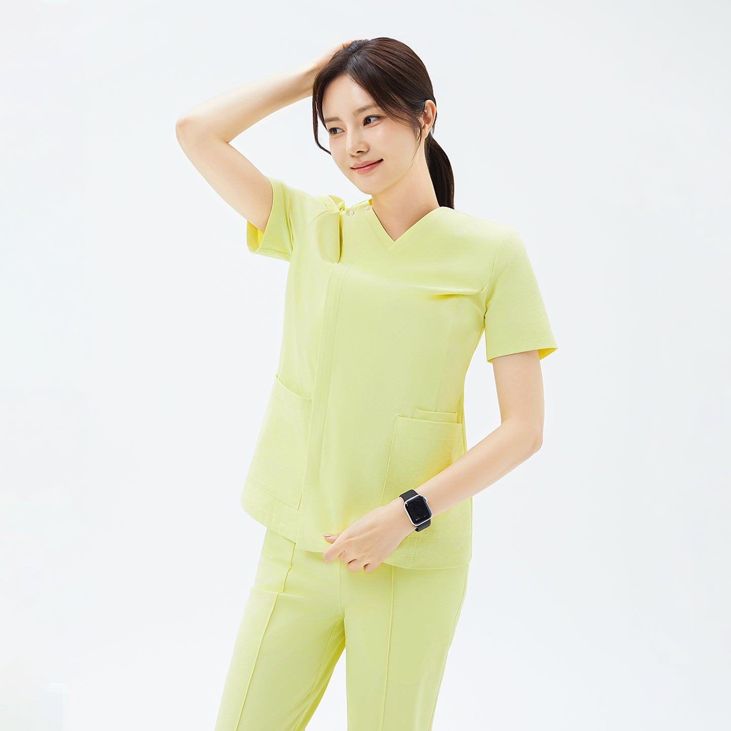 Image of pineapple yellow, the OS-223 scrub top combines gentle stretch fabric with a clean silhouette, ensuring effortless movement and a bright, polished appearance throughout the day.