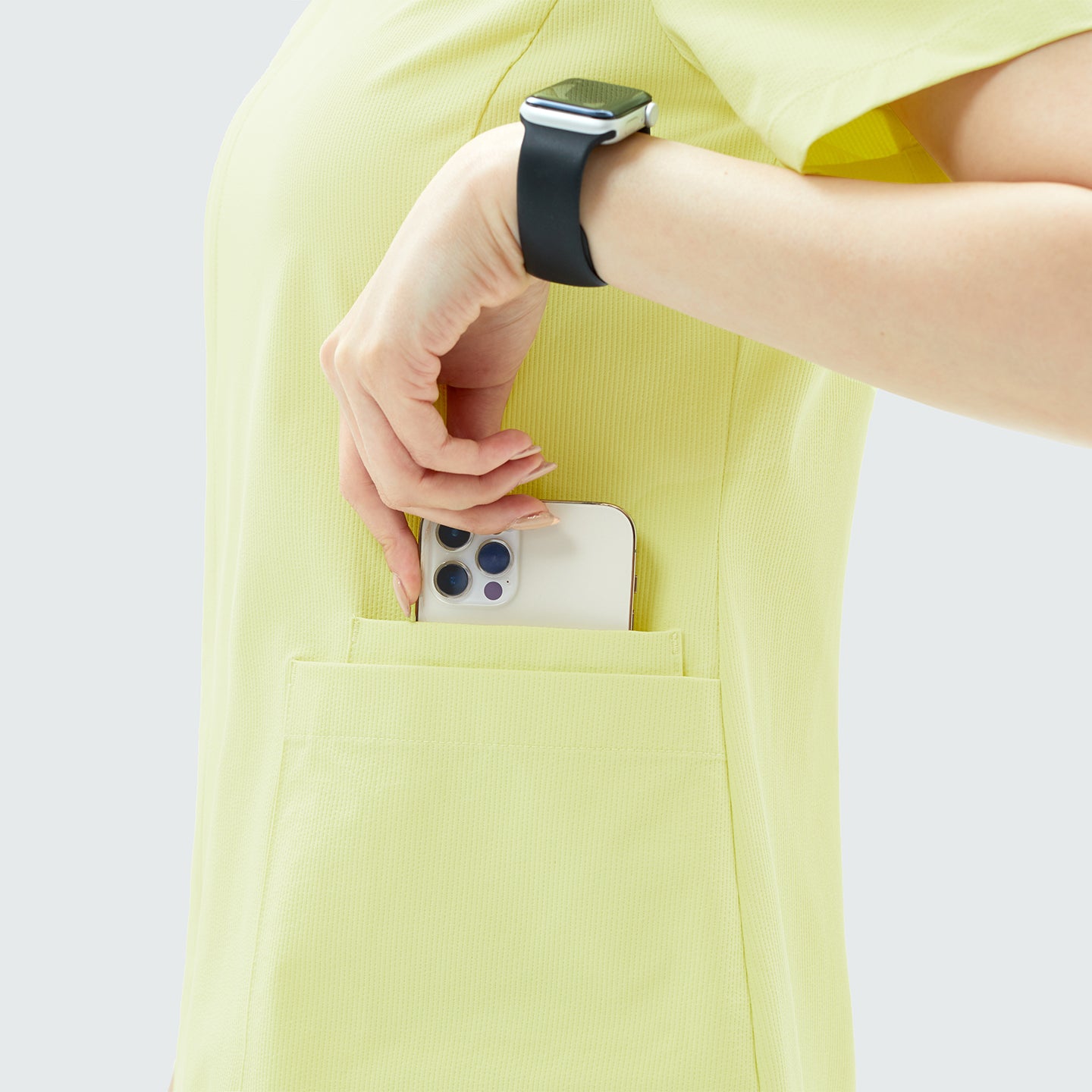 Image of Designed for practicality, the OS-223 scrub top includes spacious front pockets that easily hold essentials like a phone, pen, or small tools.