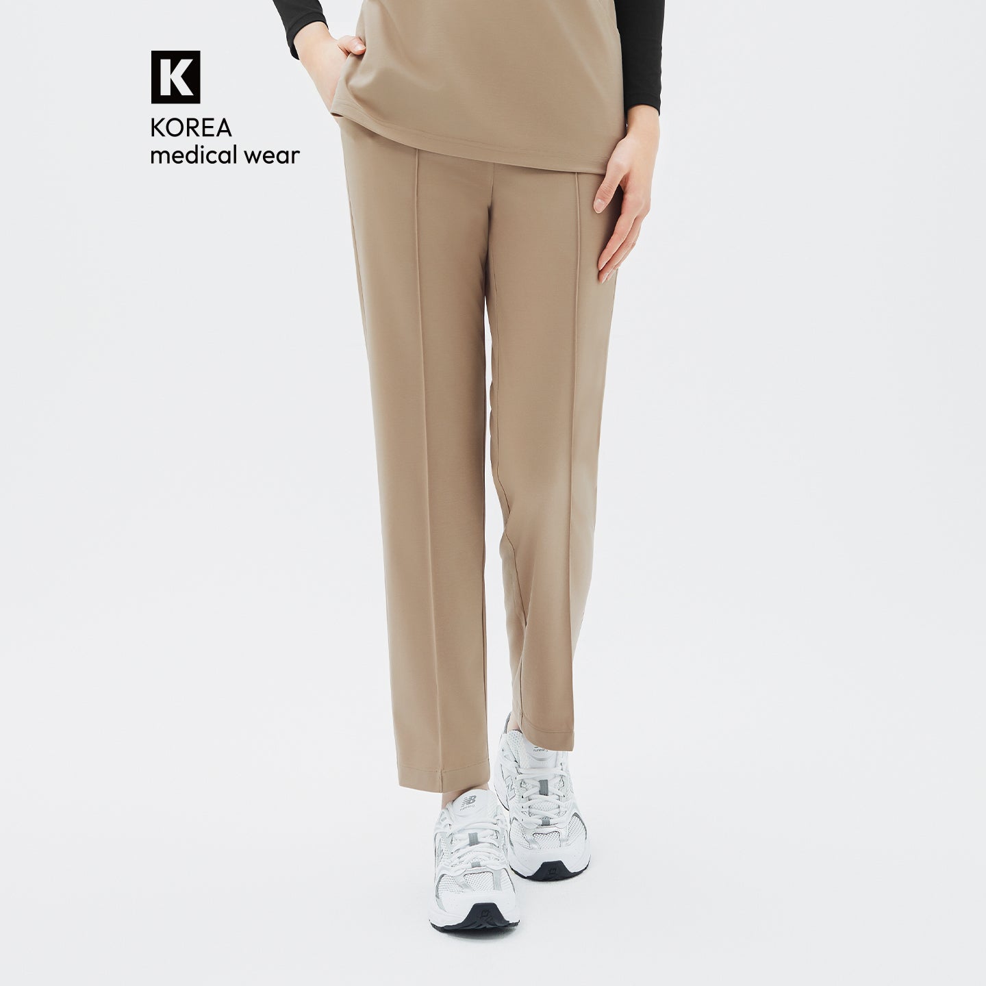 Image of Soft beige tones add a refined, natural charm to the look.
The straight fit and clean front seam create a streamlined silhouette.