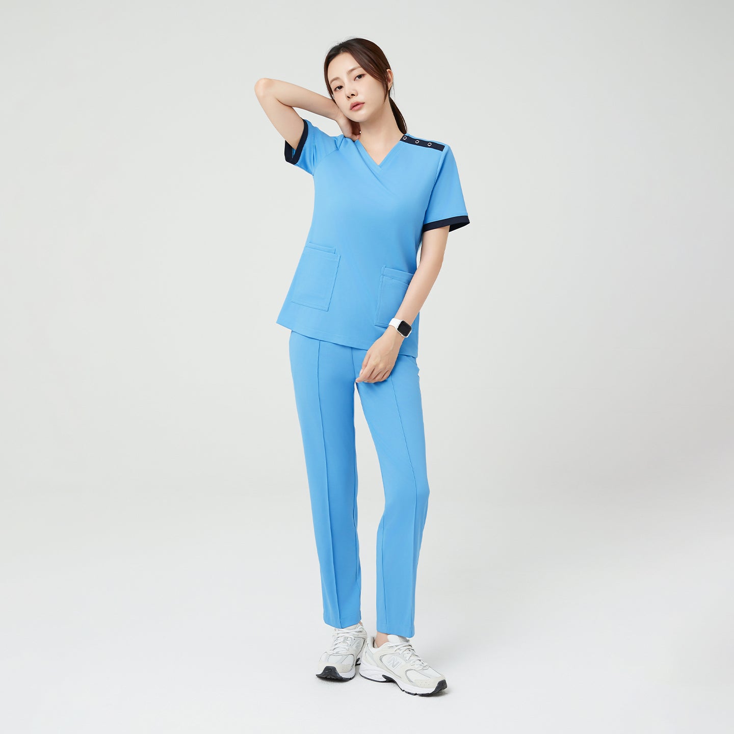A full-body view of the Sky Blue OS-231 scrub set, featuring a clean, minimal silhouette and comfortable fit — perfect for professionals who value both mobility and modern style.