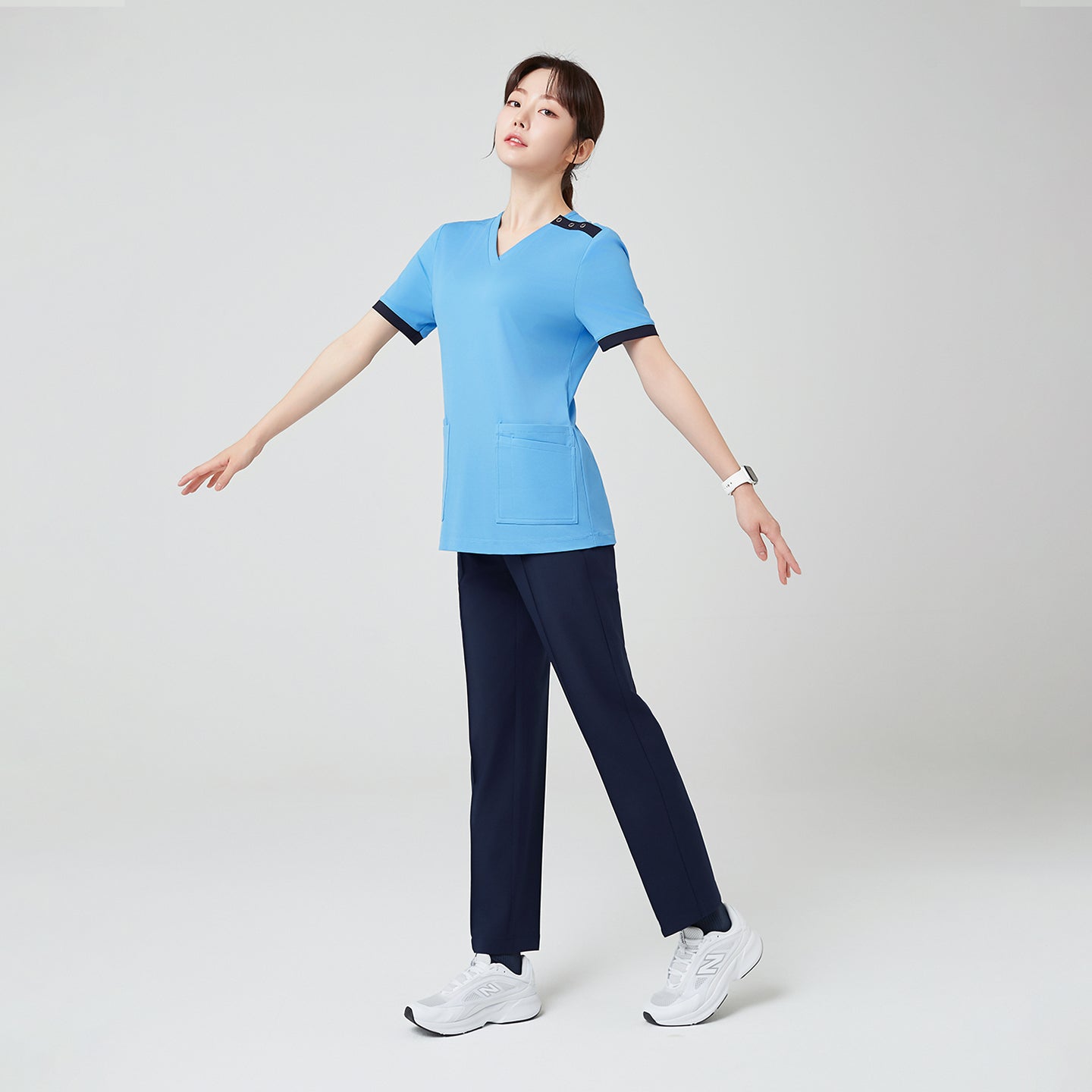 Image of The Sky Blue OS-231 scrub presents a clean, modern silhouette that allows effortless movement — combining functionality and a relaxed, graceful fit ideal for everyday wear.