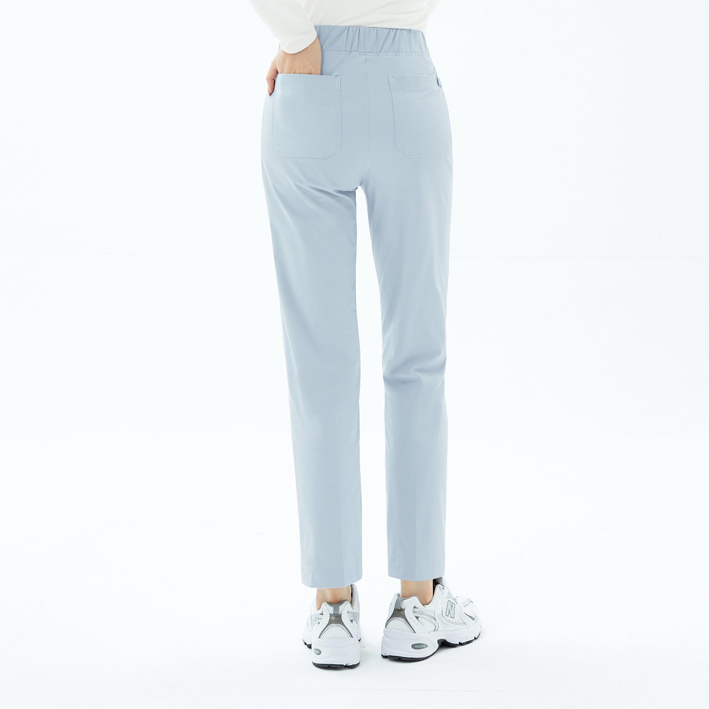 Image of A view from behind highlights the practical dual back pockets of the Smoky Blue Premium Banding Scrub Pants.