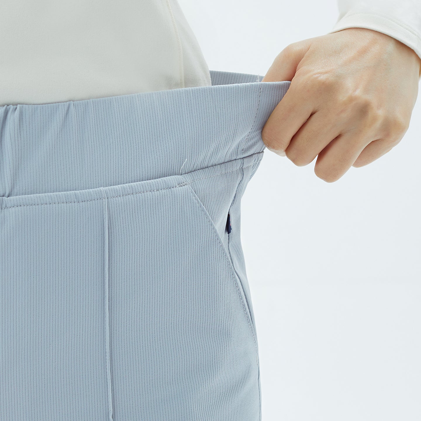 Image of Close-up of the Smoky Blue Premium Banding Scrub Pants reveals fine ribbed texture and neatly stitched pockets, combining functionality with subtle sophistication.