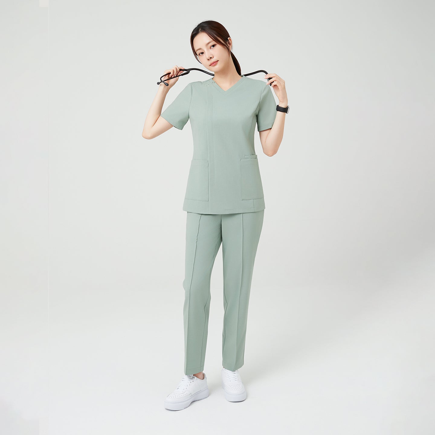 The Soft Mint Scrub Set highlights a clean, structured silhouette with subtle modern detailing.
The calm pastel hue pairs with practical double pockets, creating a look that’s both professional and effortlessly fresh.