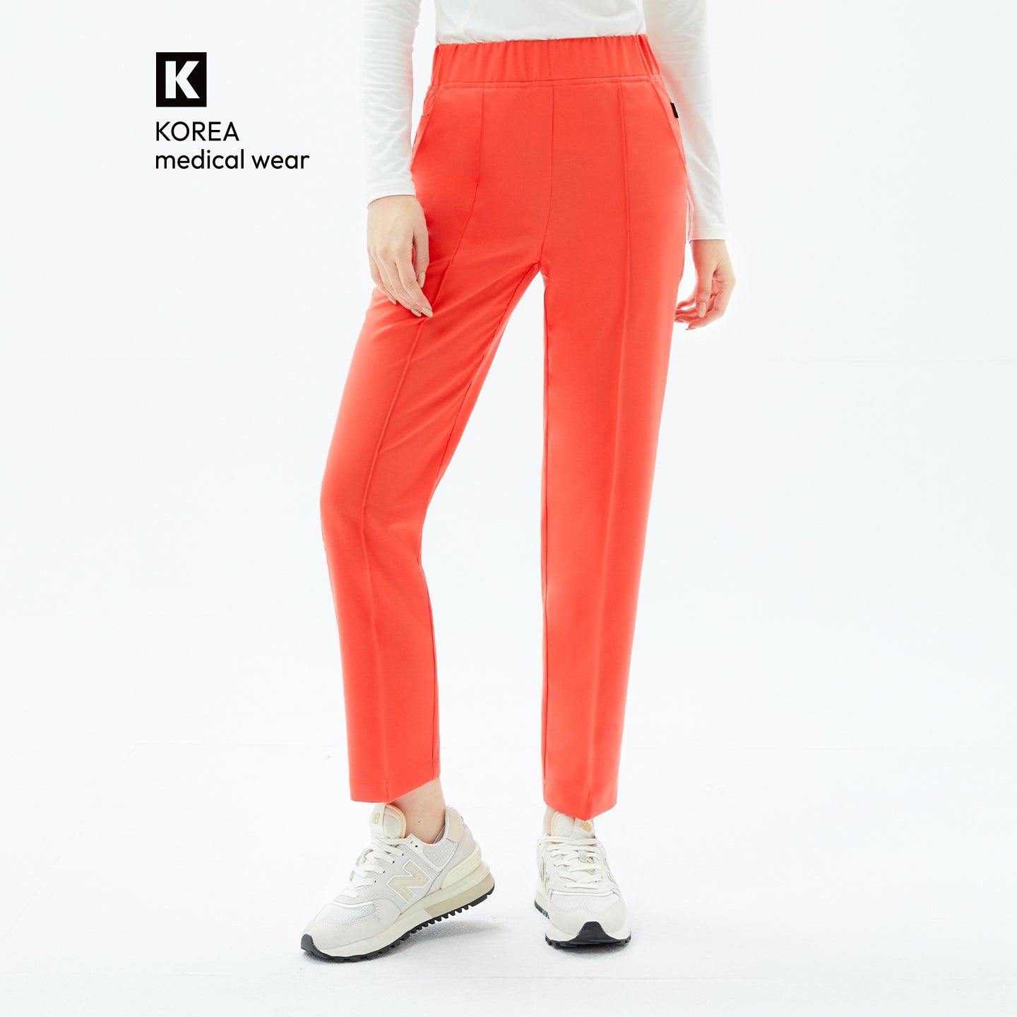 Image of Tiger Orange Premium Banding Pants are The smooth, straight-leg silhouette with a flexible waistband ensures effortless comfort and a flattering, professional fit.