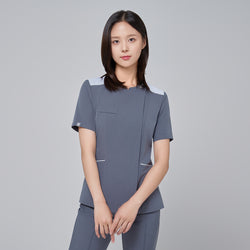 Image of Close-up detail of the one-button closure and front zipper on TUL OS-202 Women's One Button Front Zipper Scrub Top in Blue Gray, illustrating quality craftsmanship and contemporary design.