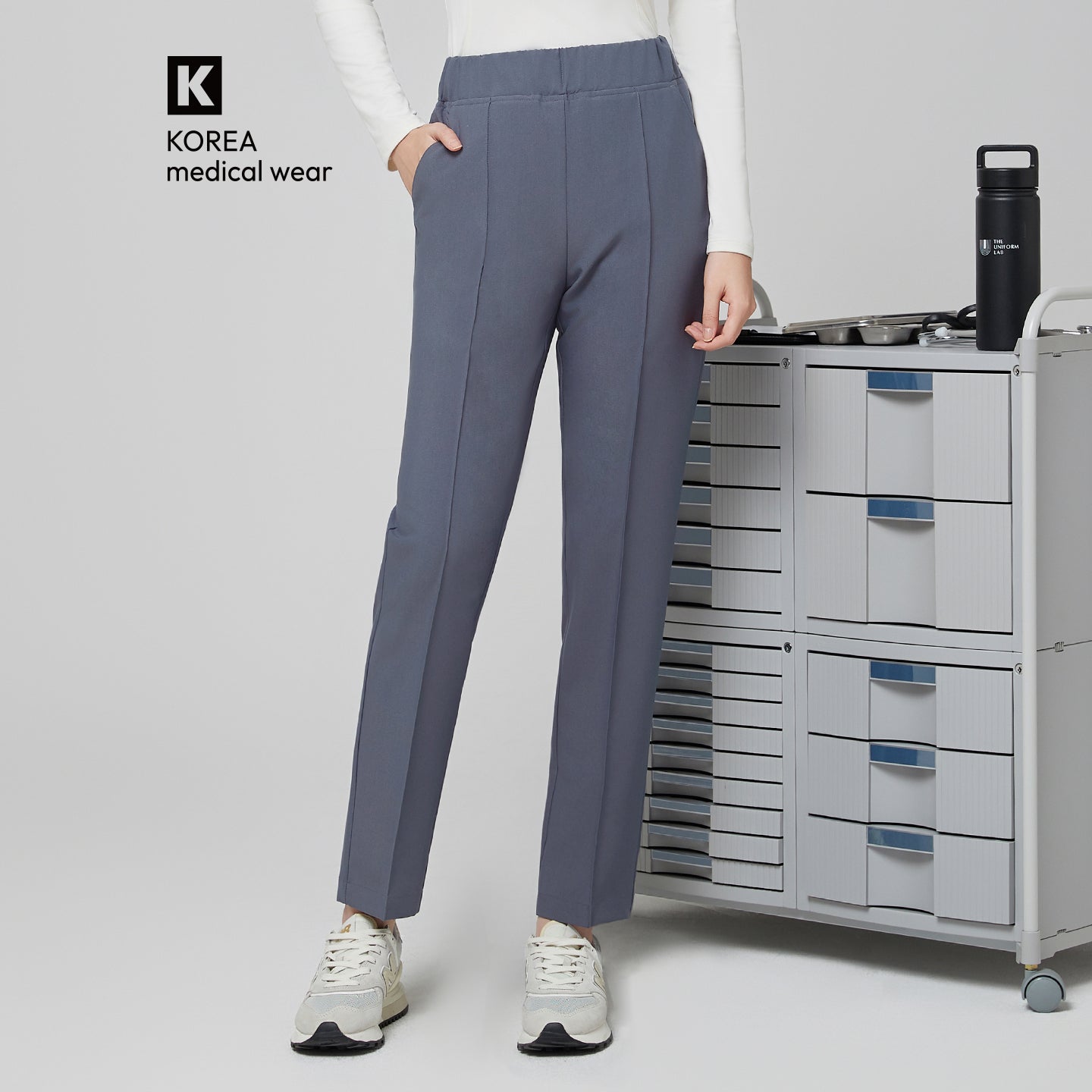 Image of Front view of TUL Women's Premium Banding Pants in Blue Gray, featuring a sleek seam design and tailored fit.