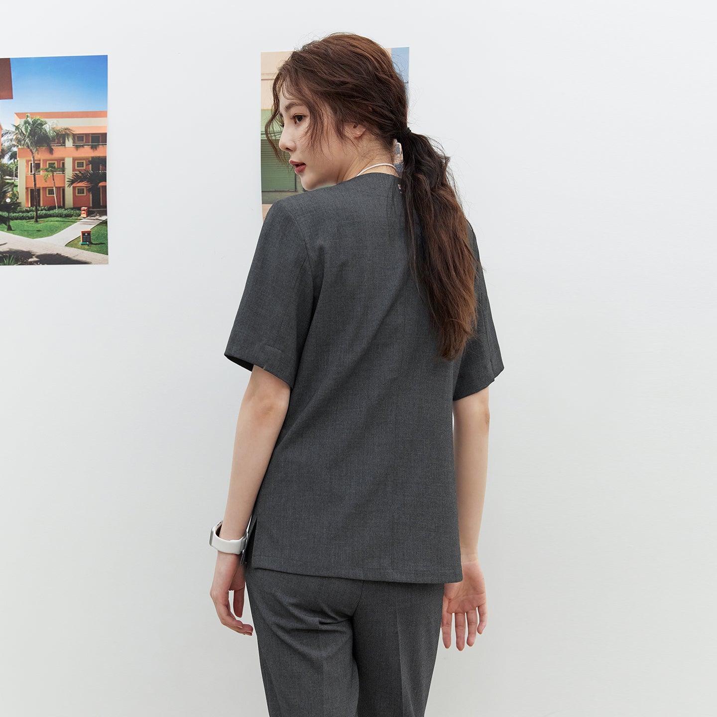 Back view of TUL OS-186 Women's Snap Button Scrub Top in Charcoal Gray, showing a clean seam design and short sleeves.