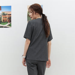 Image of Back view of TUL OS-186 Women's Snap Button Scrub Top in Charcoal Gray, showing a clean seam design and short sleeves.