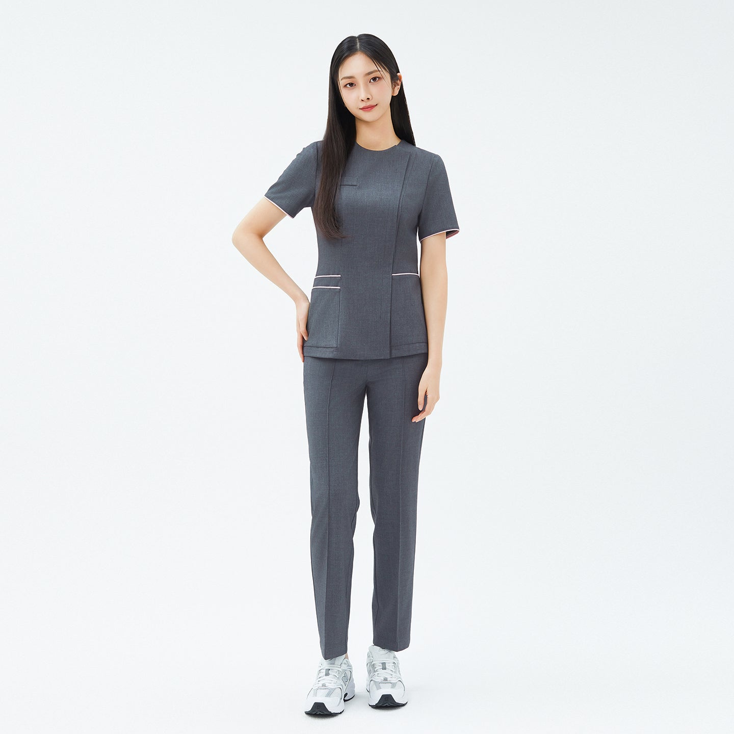 Image of Front view of TUL OS-211 Women's Edge Stripe Scrub Top in Chacoal Gray, paired with matching pants for a cohesive, professional ensemble.