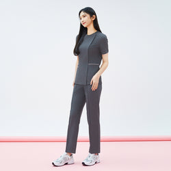 Image of Full-length shot of TUL Women's Premium Banding Pants in Chacoal Gray, paired with a matching scrub top for a cohesive, professional look.