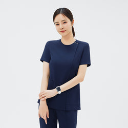 Image of Front view of TUL OS-213 Women's Dual Snap Front Zipper Scrub Top in Classic Navy, emphasizing the tailored fit and two spacious pockets.