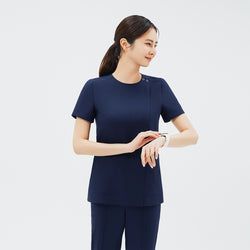 Image of Model wearing TUL OS-213 in Classic Navy, checking a watch, highlighting the dual snap neckline and practical design.