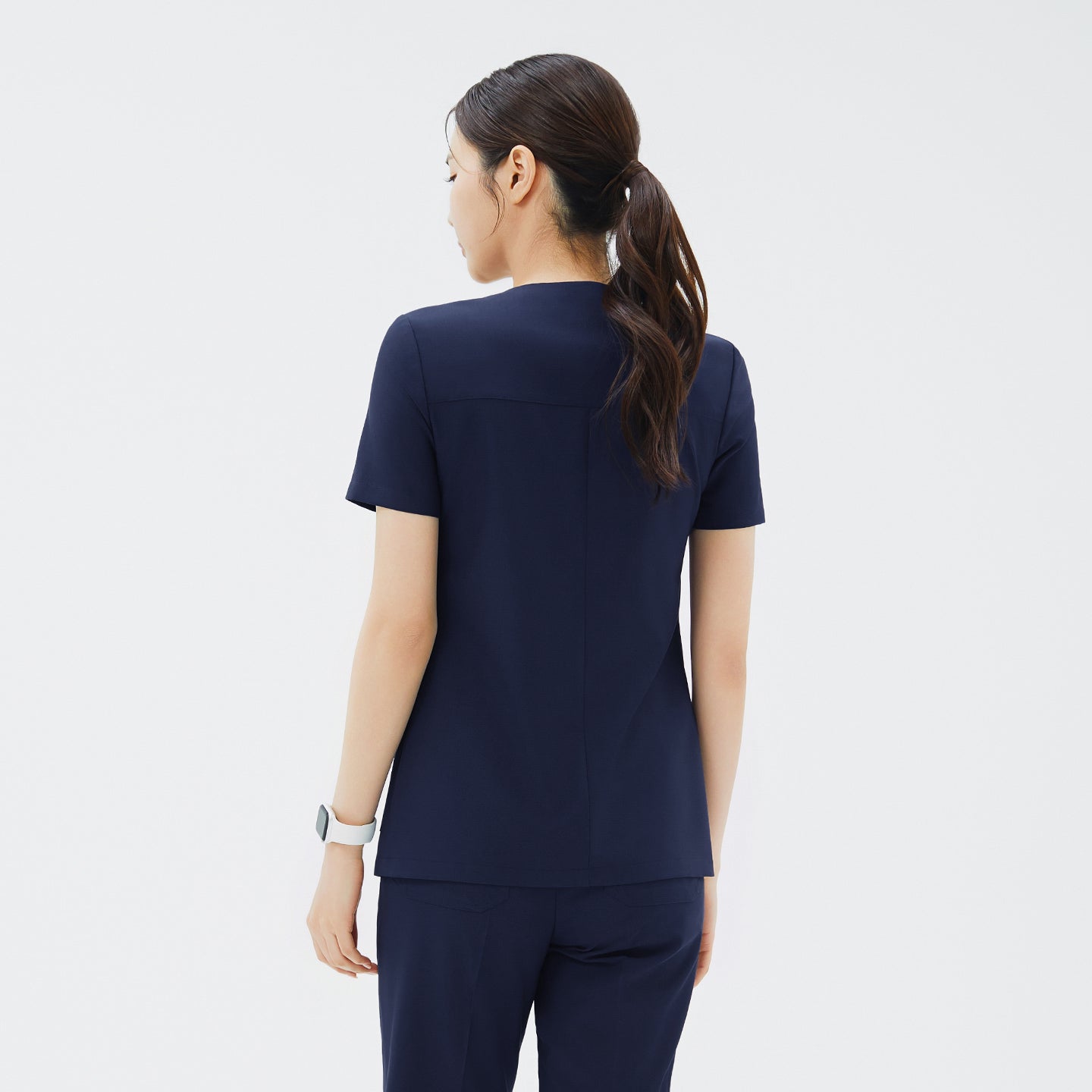 Image of Back view of TUL OS-213 Classic Navy scrub top, featuring a streamlined silhouette and comfortable fabric for all-day wear.
