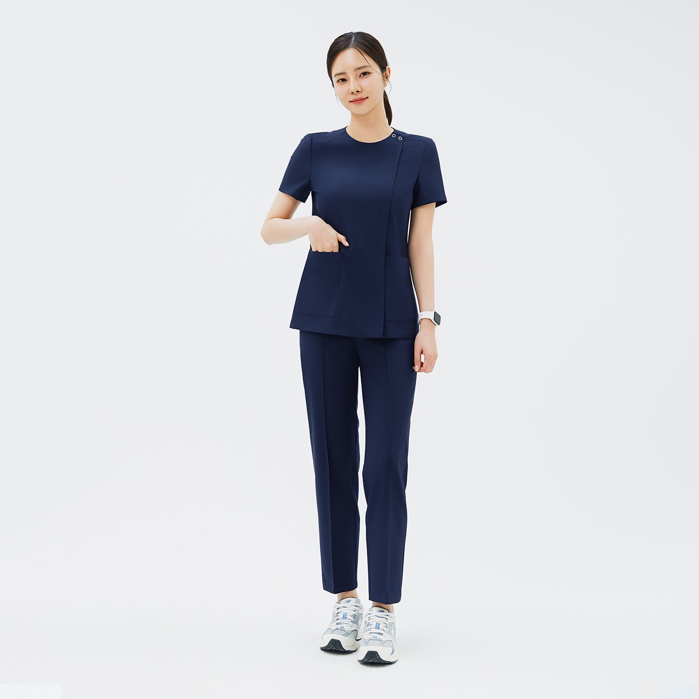 Image of Full-length shot of TUL OS-213 Women's Dual Snap Front Zipper Scrub Top in Classic Navy, paired with matching pants for a cohesive uniform.