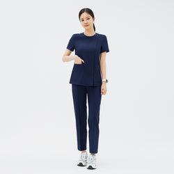 Image of Full-length shot of TUL OS-213 Women's Dual Snap Front Zipper Scrub Top in Classic Navy, paired with matching pants for a cohesive uniform.