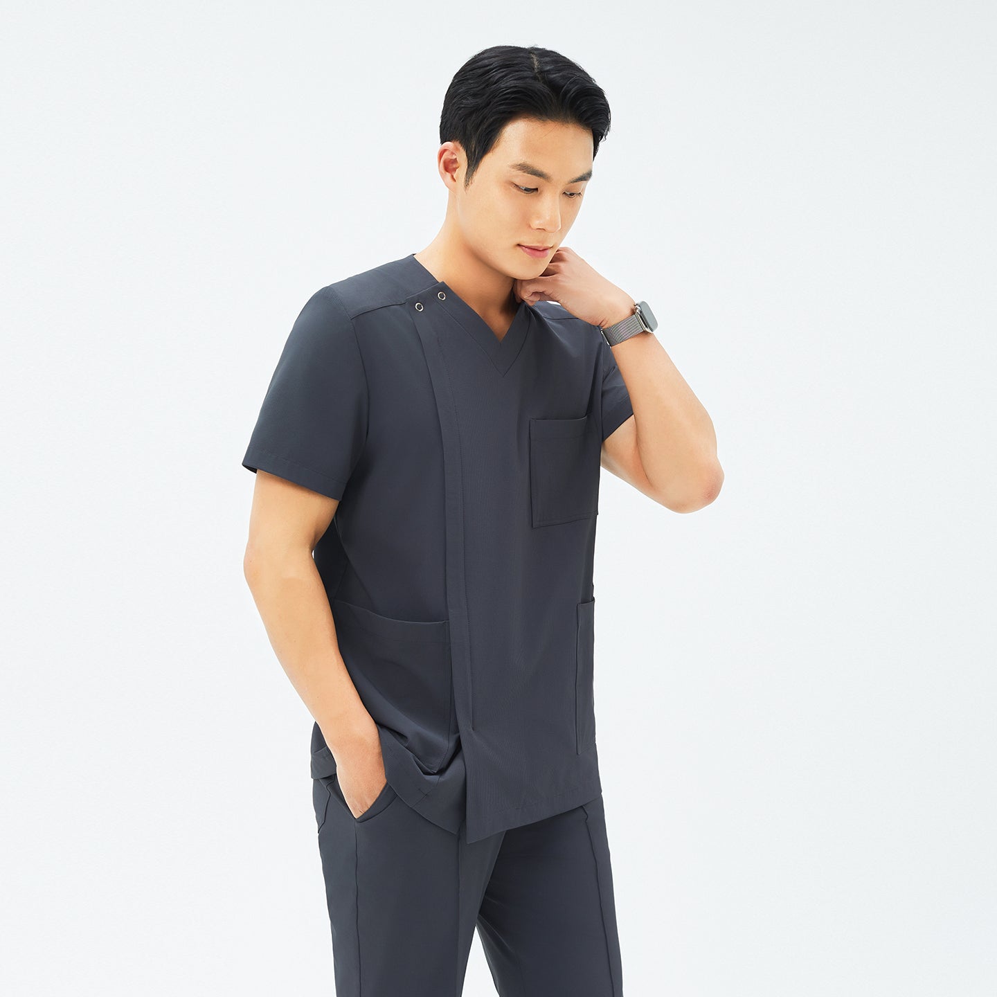 Side angle of TUL DS-186 Deep Gray scrub top, highlighting a tailored fit and durable fabric construction.