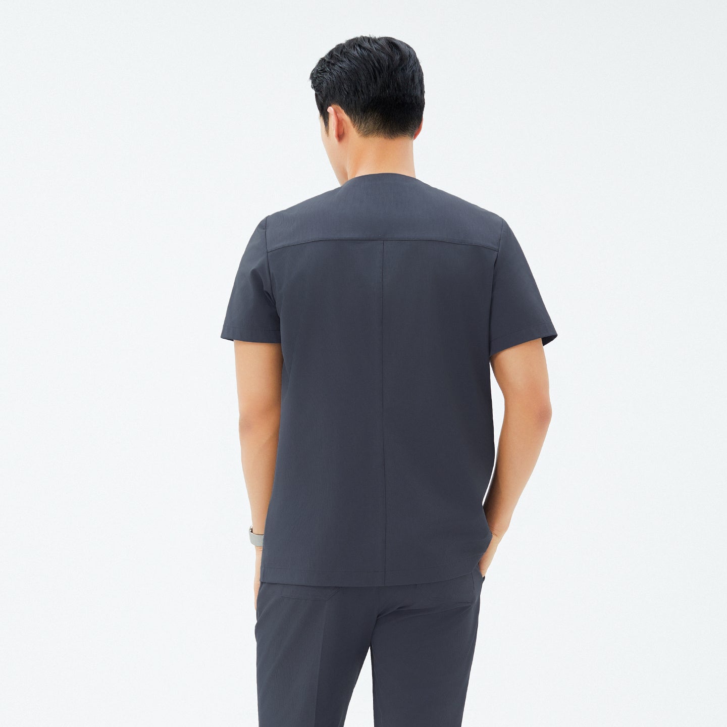 Image of Back view of TUL DS-189 Men's Deep Gray scrub top, highlighting structured seams and a clean, modern silhouette.