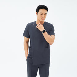 Image of Model wearing TUL DS-189 Men's Deep Gray scrub top, paired with matching pants for a cohesive, professional uniform.