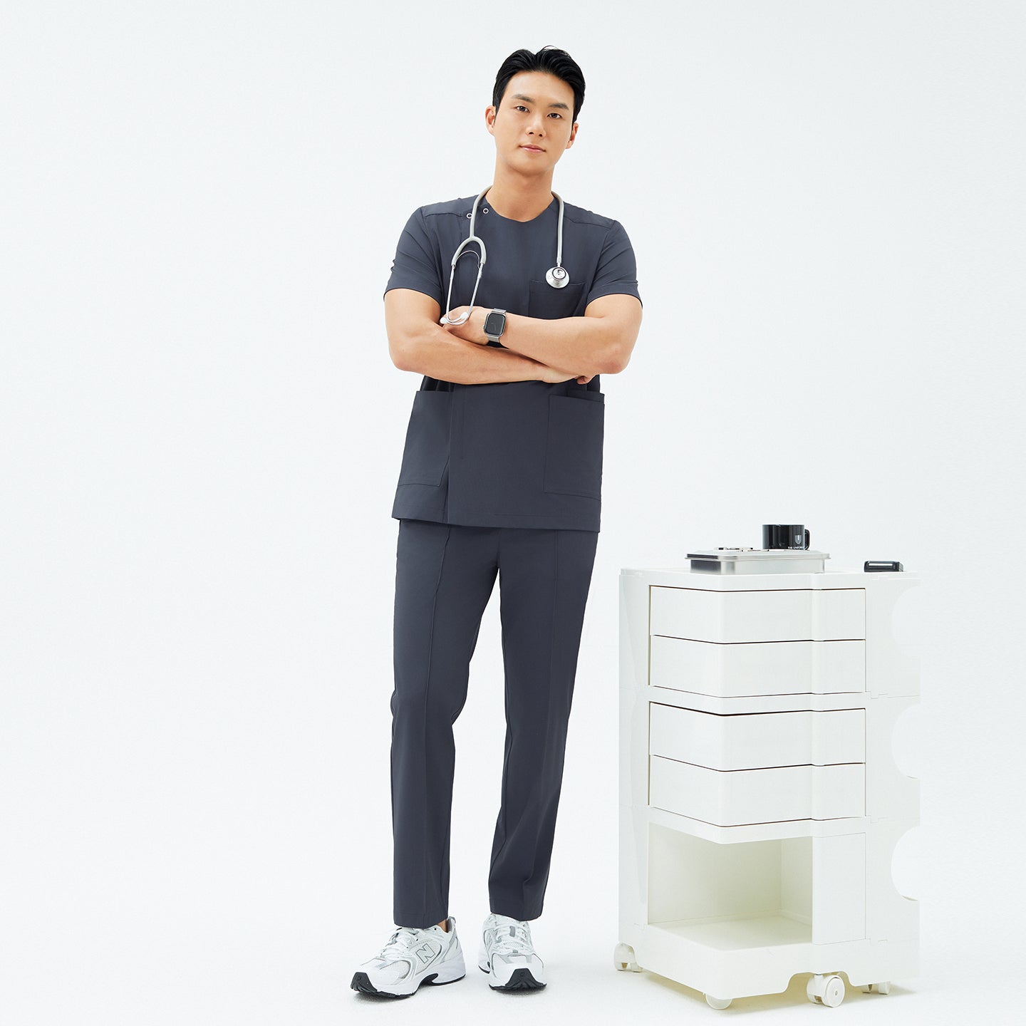 Full-length shot of TUL DS-189 Men's Round Snap Zipper Scrub Top in Deep Gray, paired with matching pants for a professional uniform look.