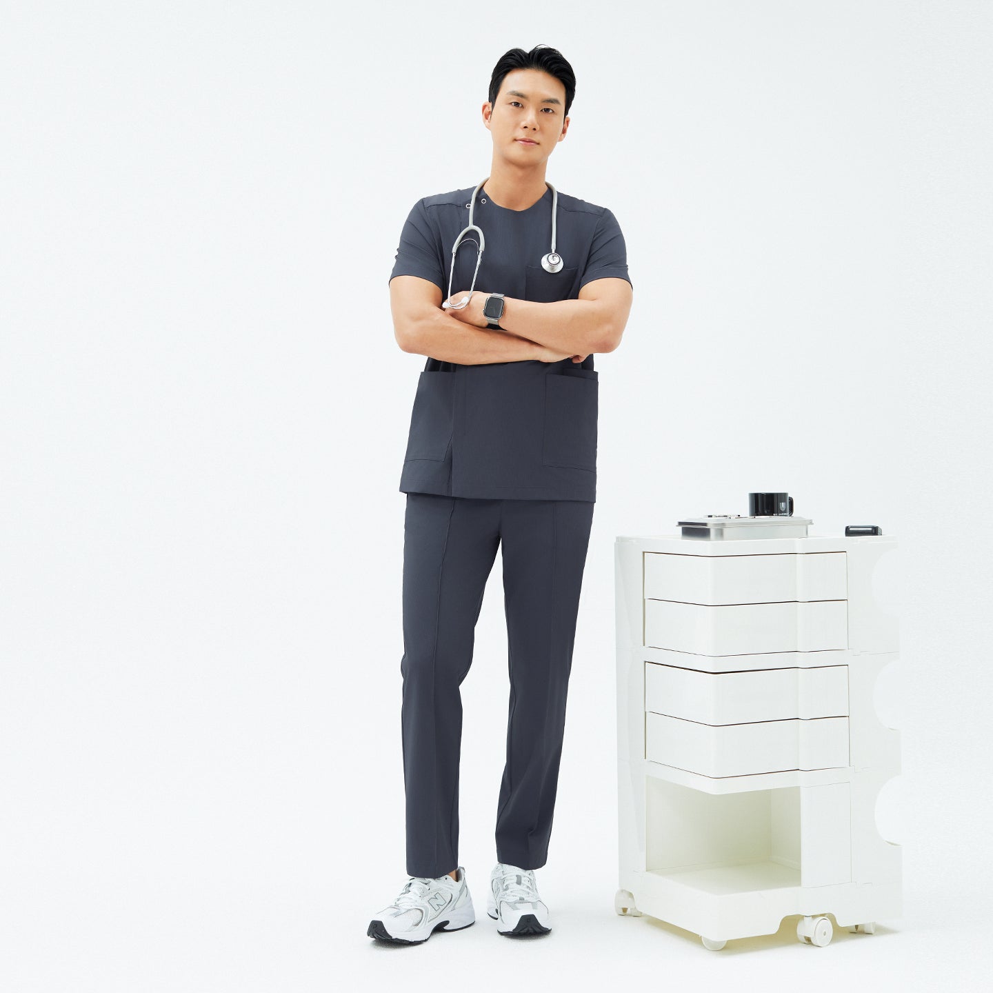 Image of Full-length shot of TUL DS-189 Men's Round Snap Zipper Scrub Top in Deep Gray, paired with matching pants for a professional uniform look.